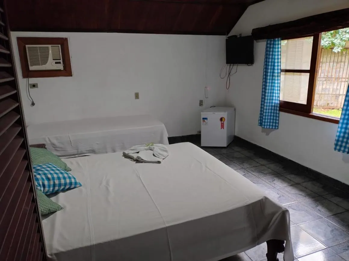 Bed in Pousada Nova Conquista