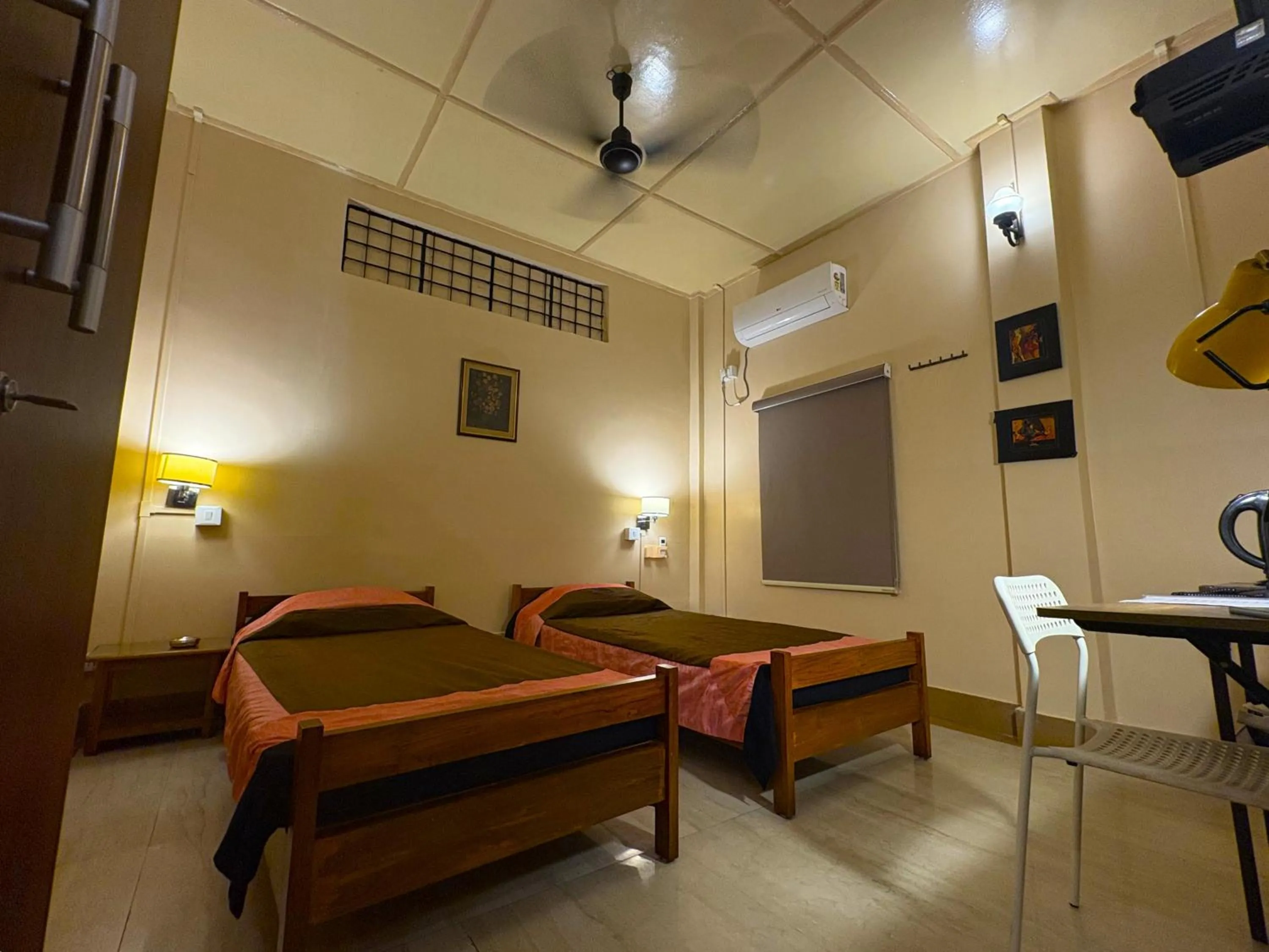 Photo of the whole room, Bed in Golaghat Gymkhana