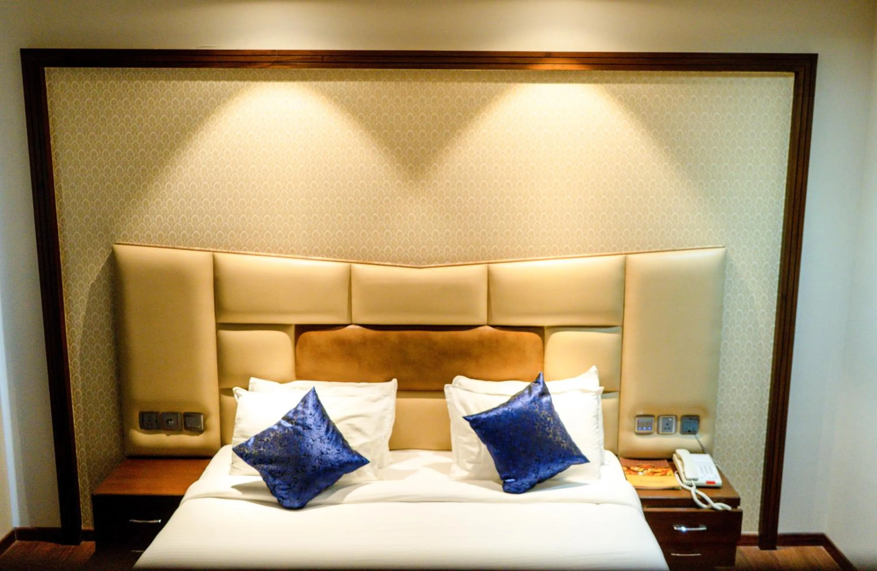 Bed in juSTa Palampur Resort & Convention Centre