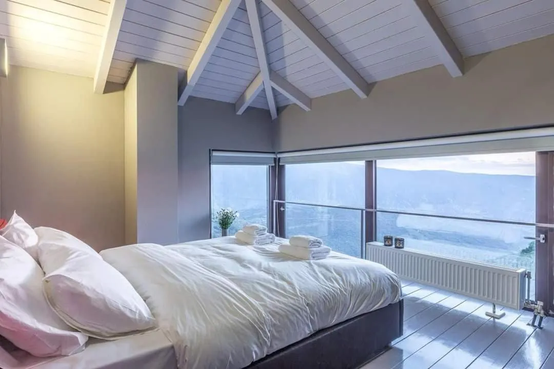Bed in Deluxe Villa by White Hills Outdoor Hot Tub