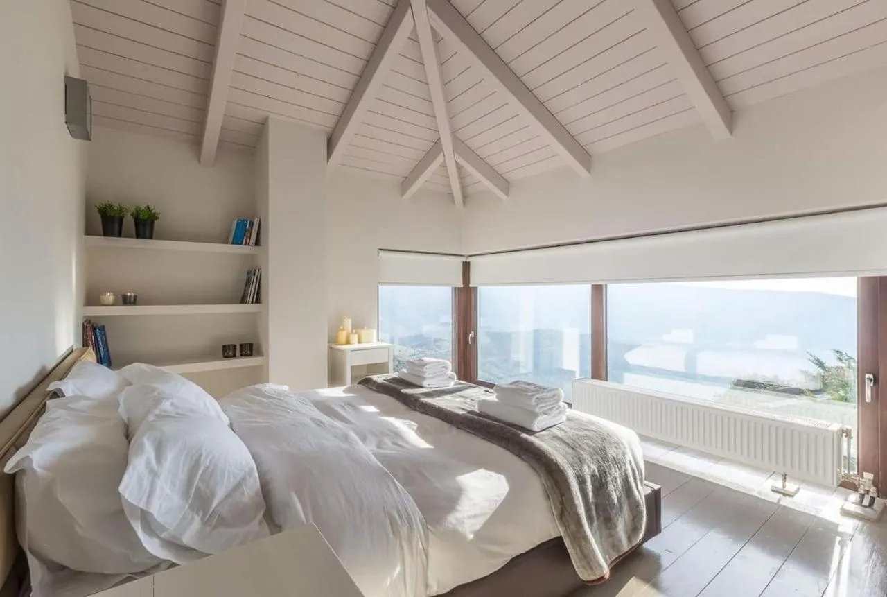 Bed in Deluxe Villa by White Hills Outdoor Hot Tub