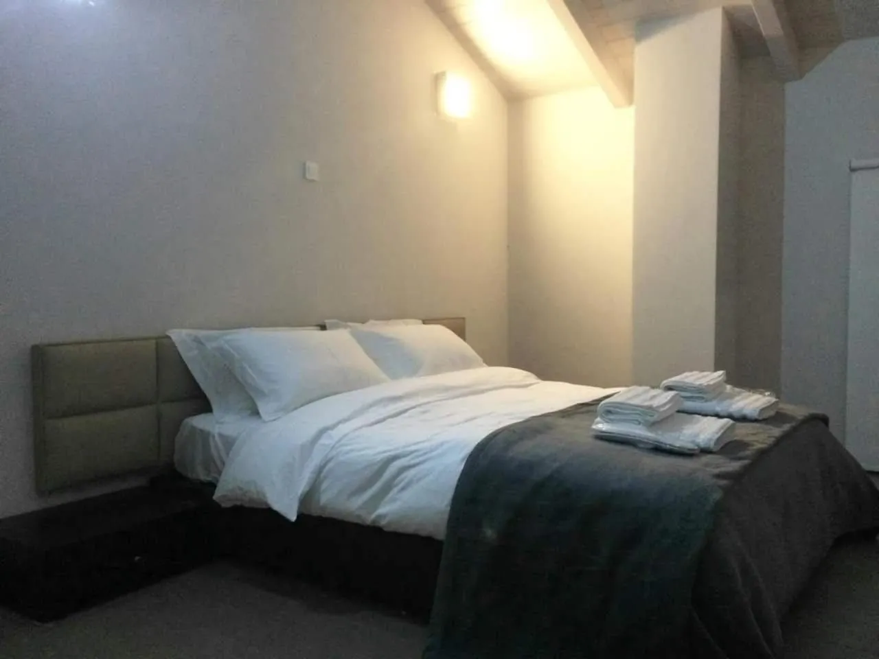 Bed in Deluxe Villa by White Hills Outdoor Hot Tub