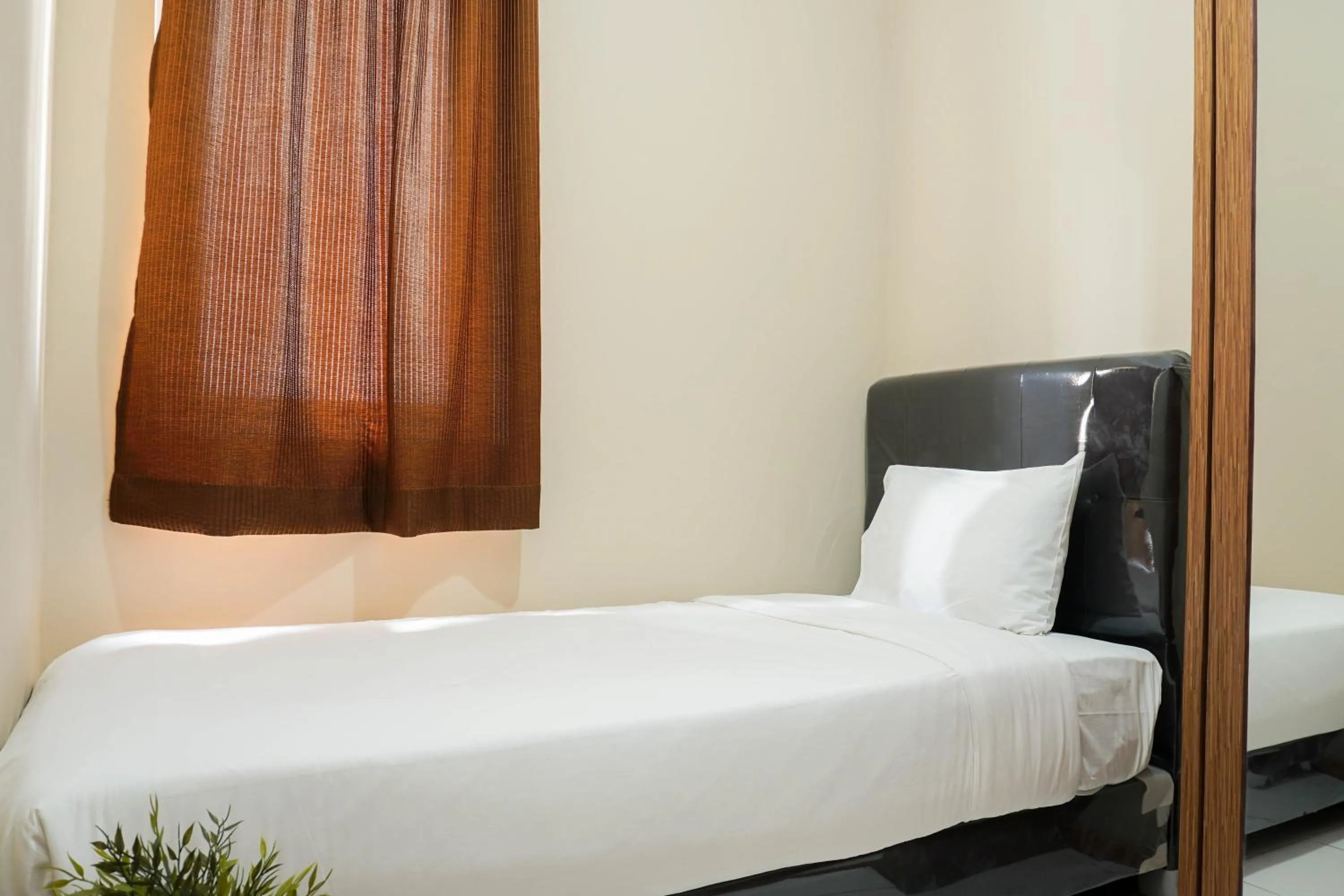 Bed in Spacious 3BR Residence at Grand Palace Kemayoran Apartment By Travelio