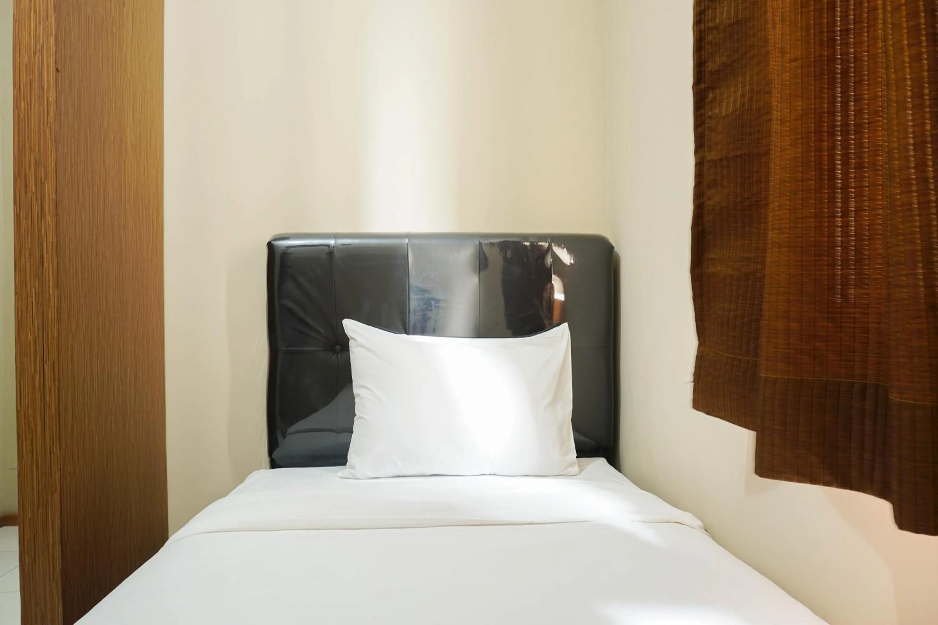 Bed in Spacious 3BR Residence at Grand Palace Kemayoran Apartment By Travelio