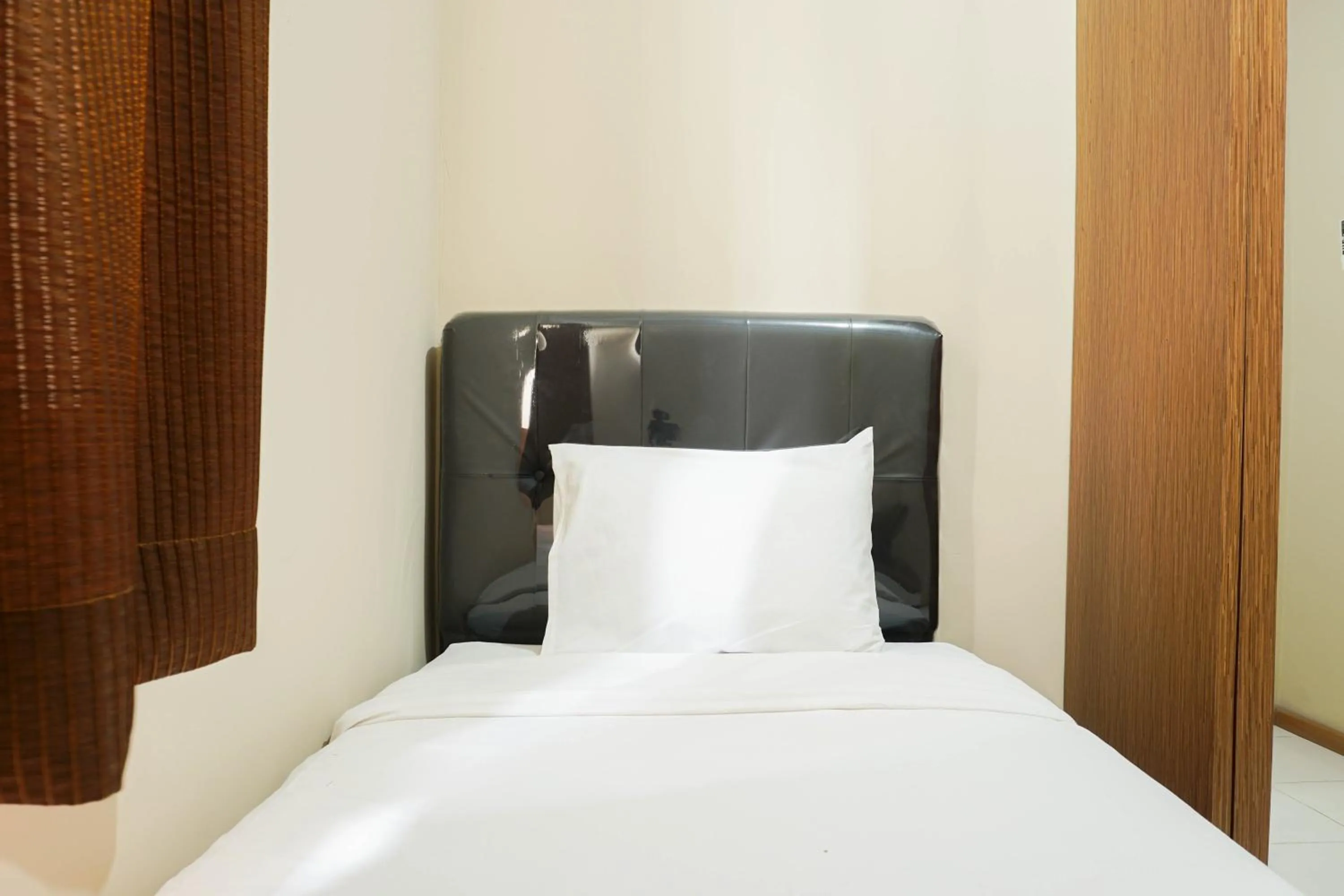 Bed in Spacious 3BR Residence at Grand Palace Kemayoran Apartment By Travelio