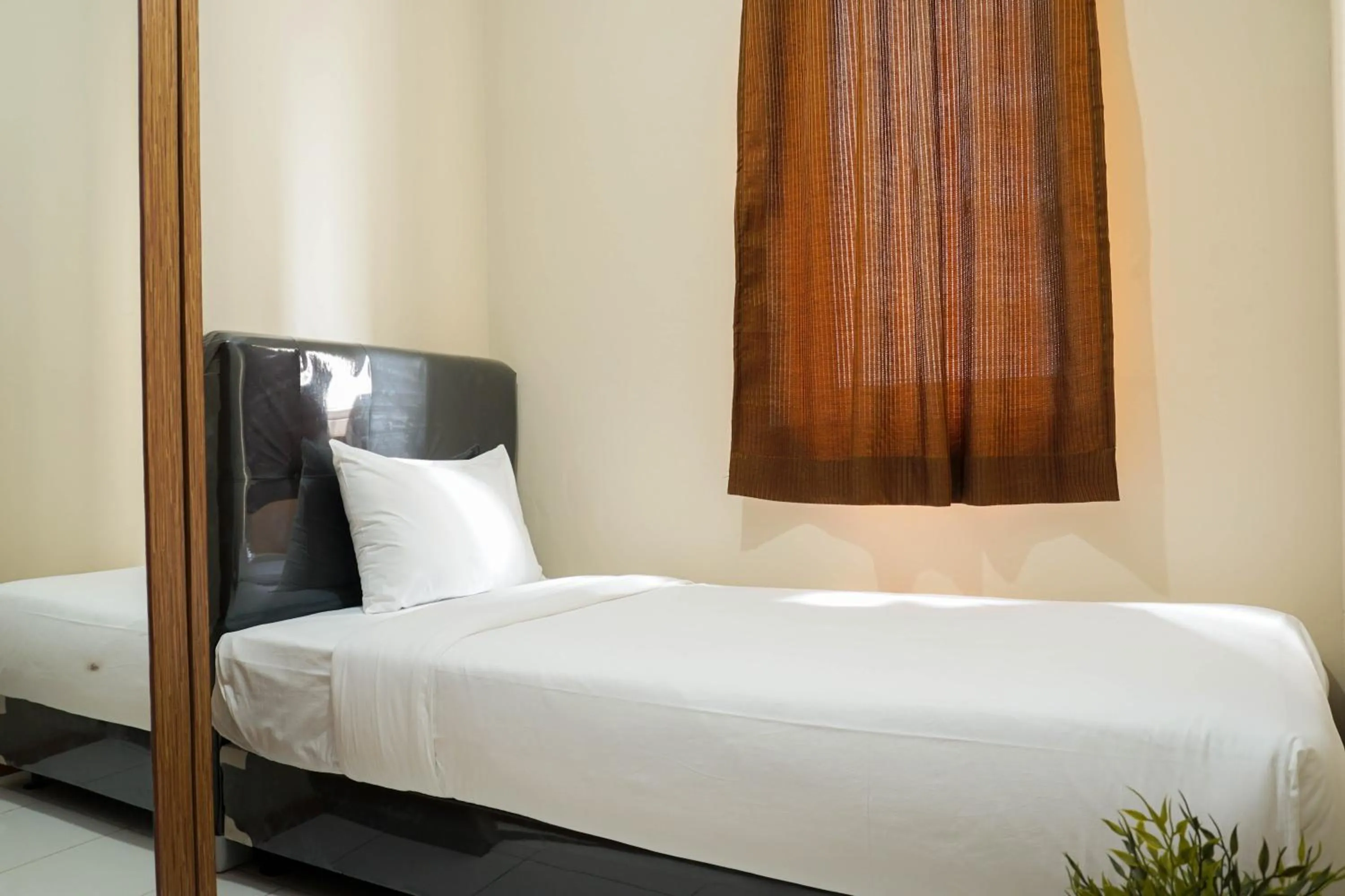 Bed in Spacious 3BR Residence at Grand Palace Kemayoran Apartment By Travelio