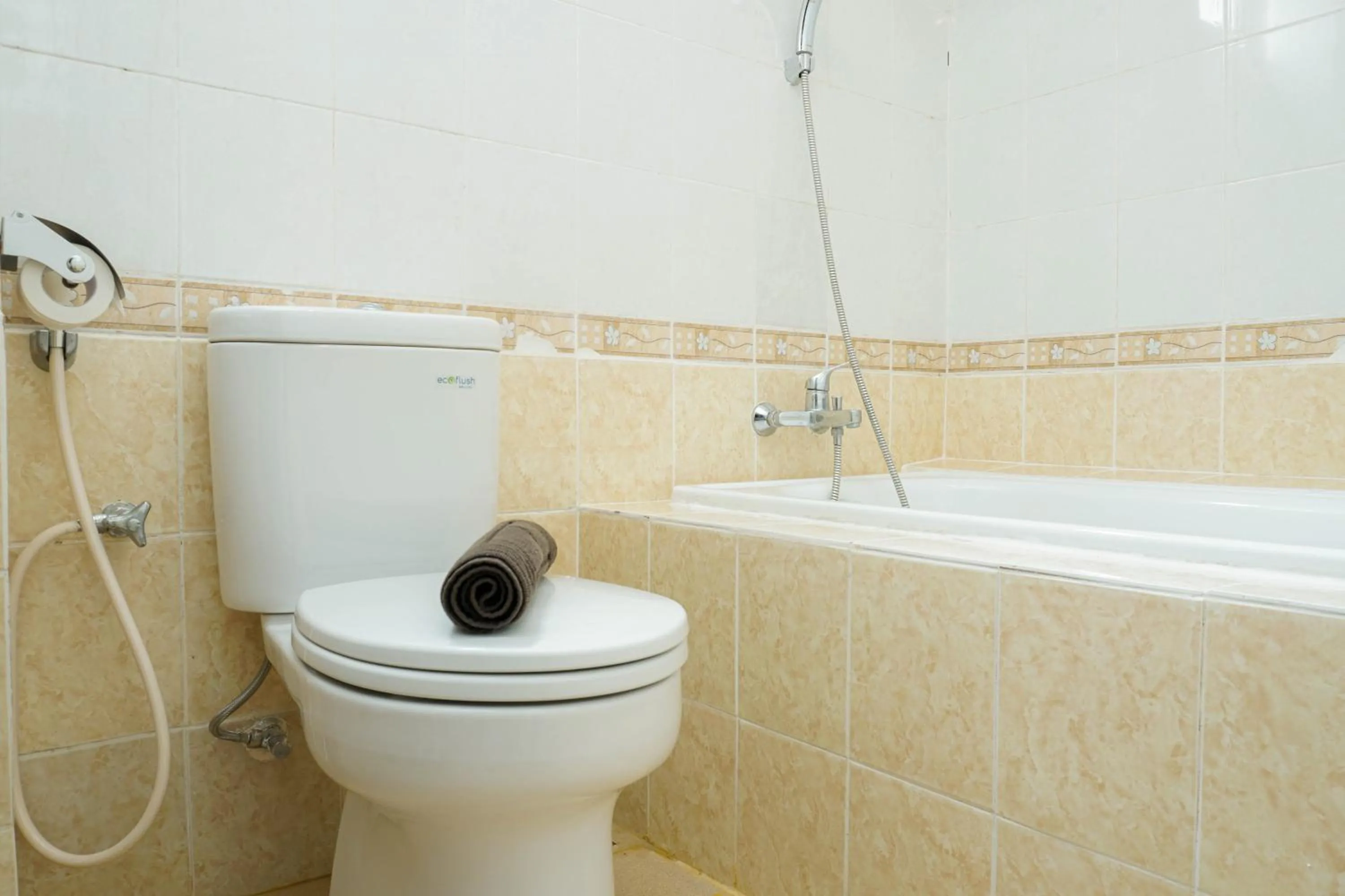 Bathroom in Spacious 3BR Residence at Grand Palace Kemayoran Apartment By Travelio