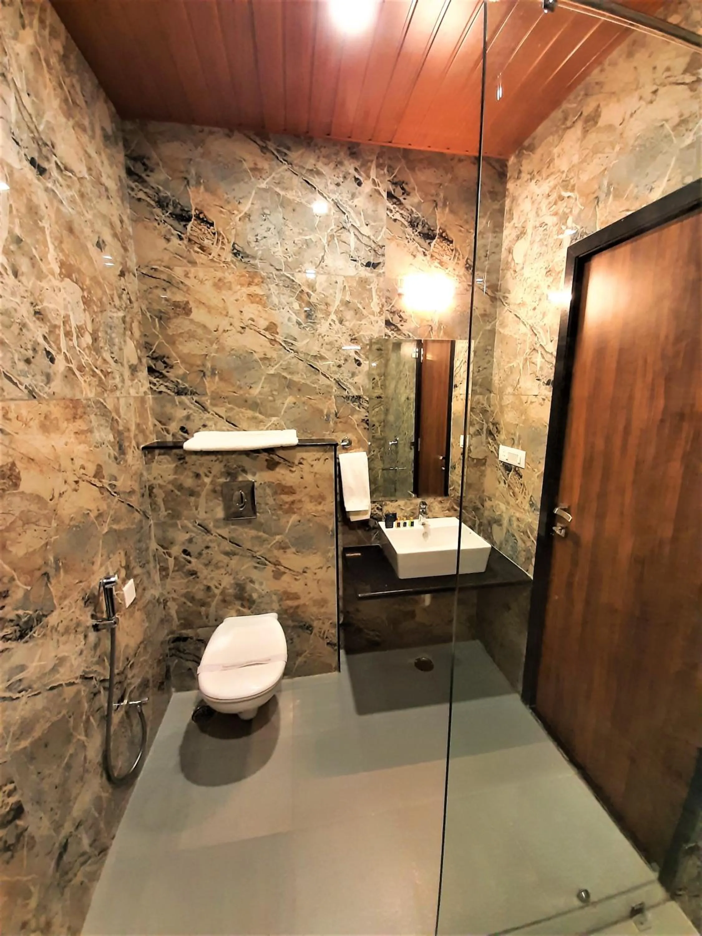 Shower in Suvin Residency with Rooftop Swimming Pool