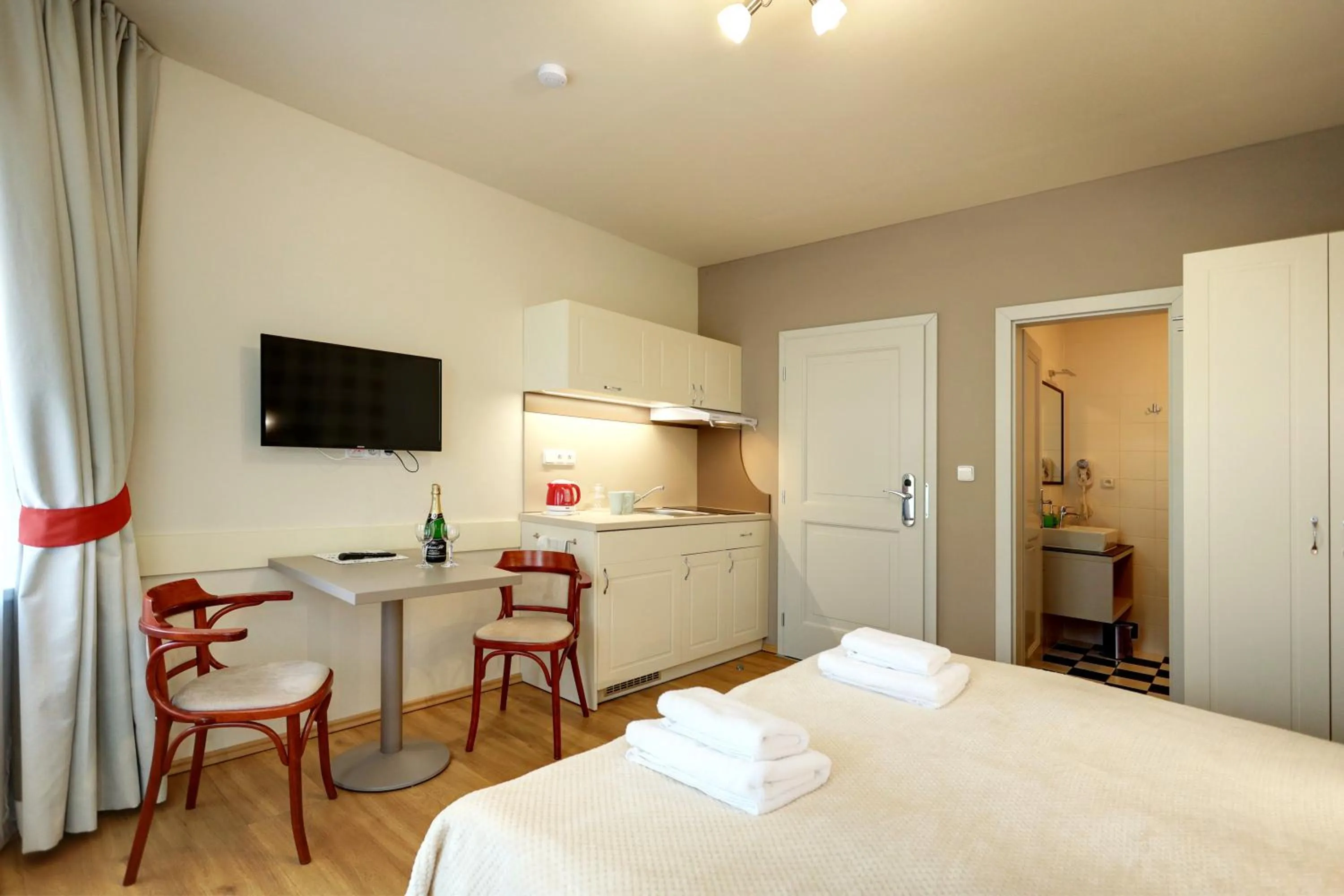 Kitchen or kitchenette, Bed in APARTMÁNY ADAM