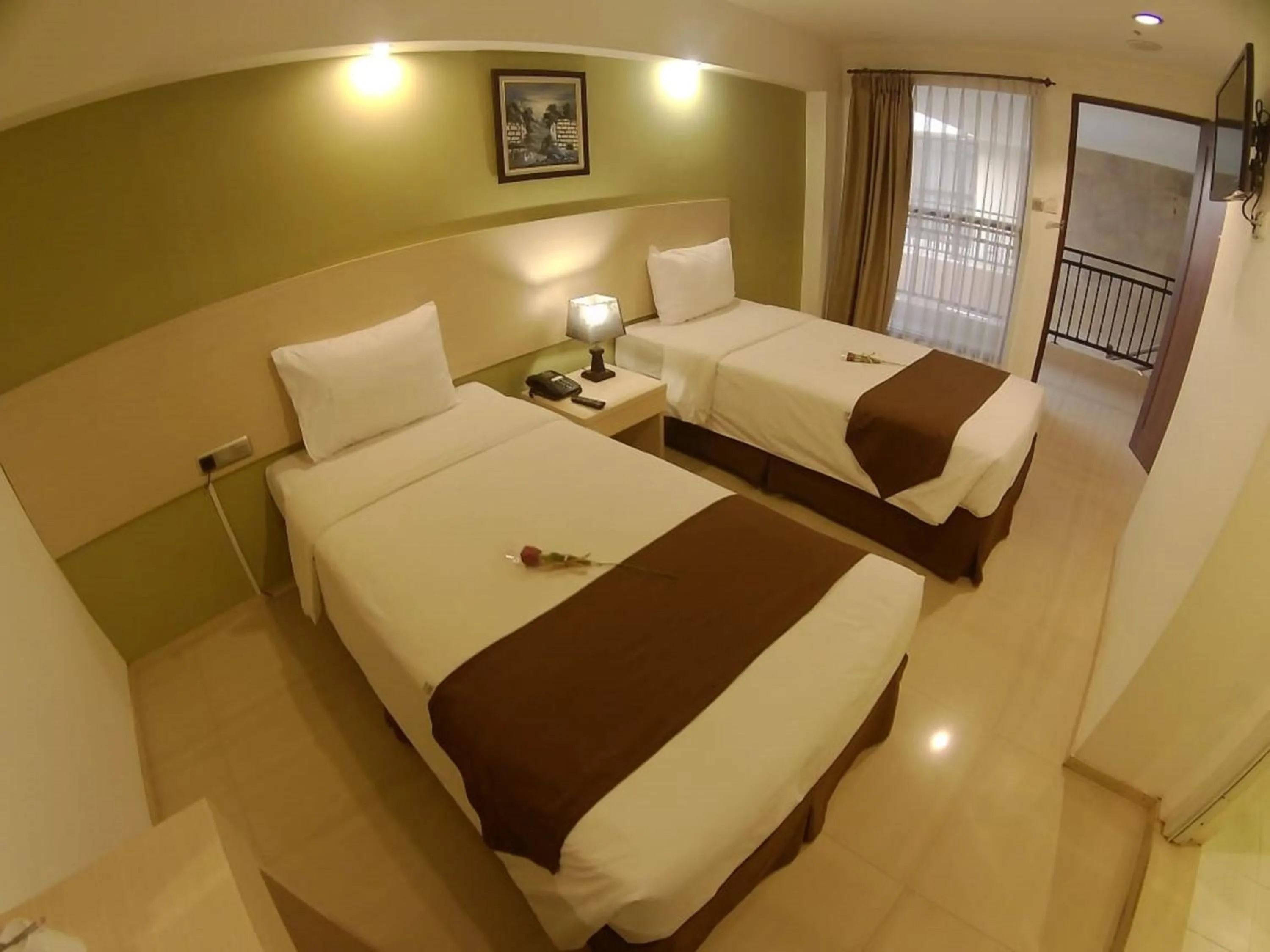 Bed in The Naripan Hotel