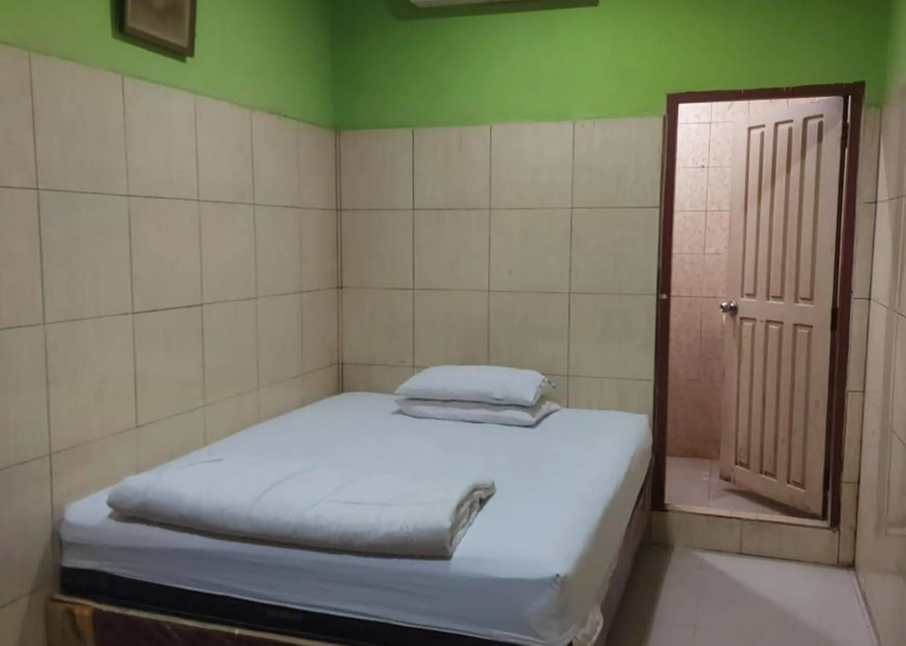 Bed in Hotel Mulia Kendari Mitra RedDoorz Bed in Hotel Mulia Kendari Mitra RedDoorz