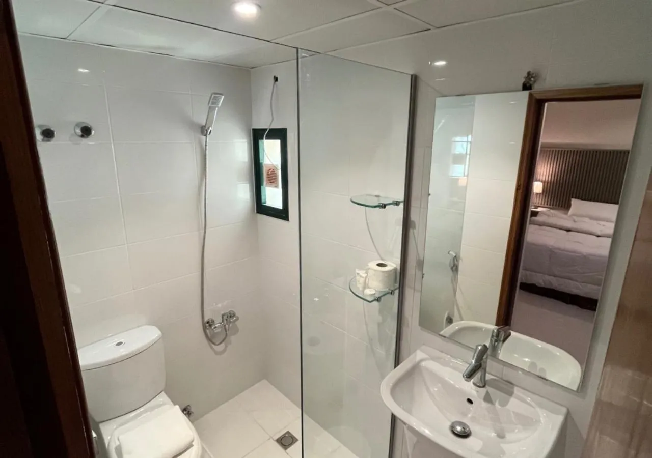 Shower, Bed in Times Square Suite Hotel