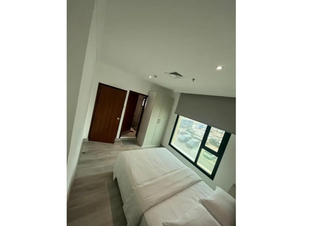 Bed in Times Square Suite Hotel