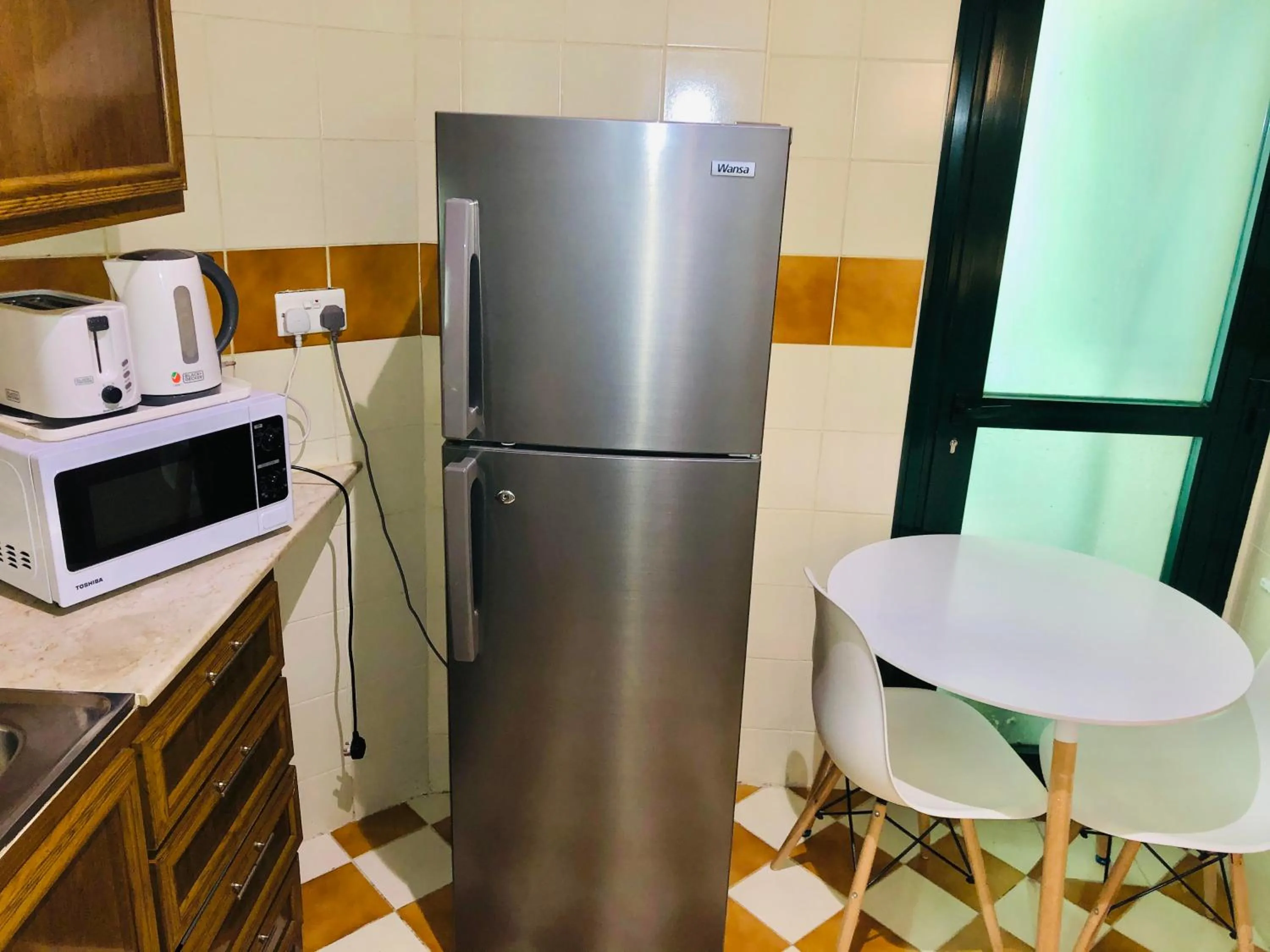 Kitchen or kitchenette in Times Square Suite Hotel