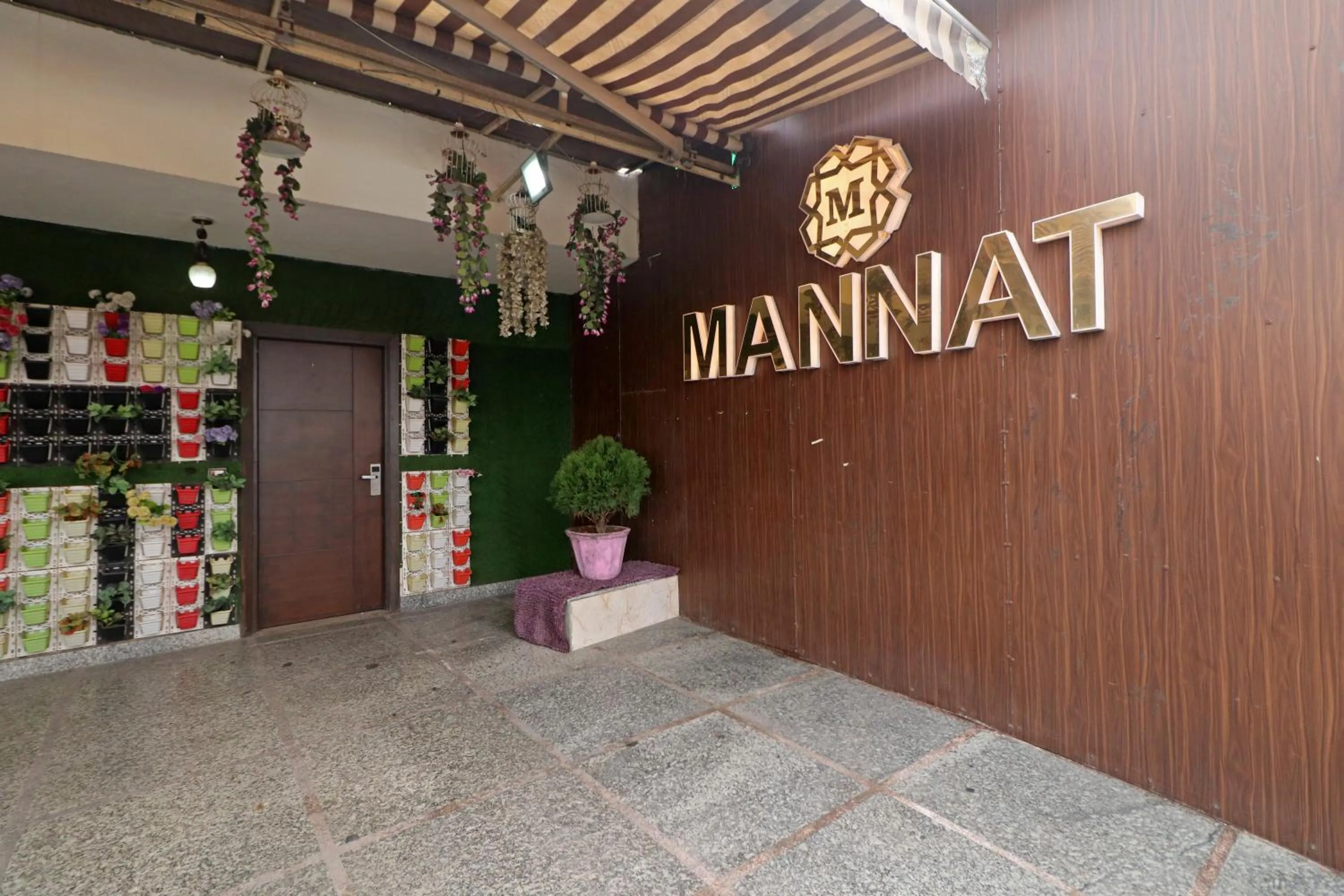 Property logo or sign in Hotel Mannat international by Mannat