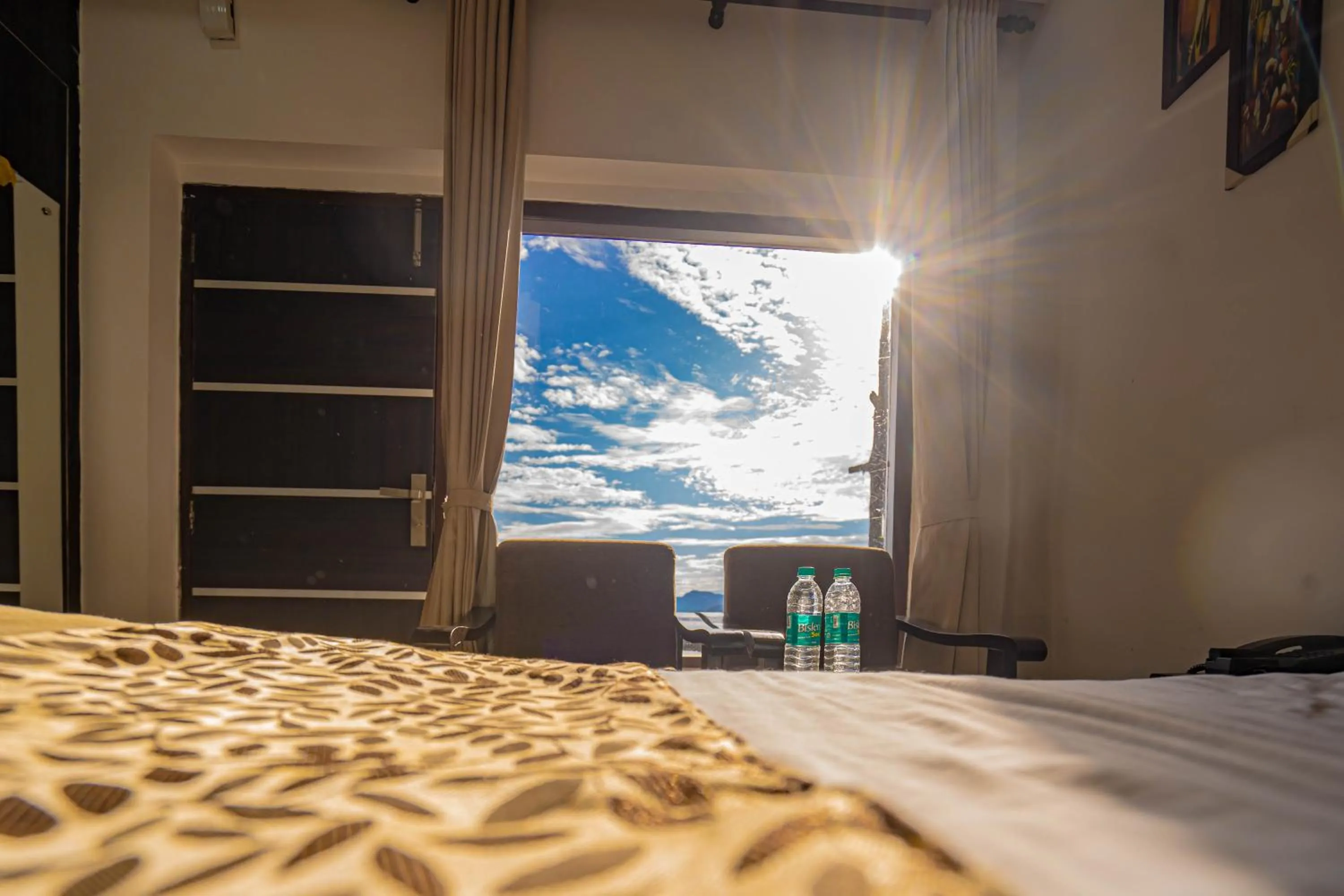 View (from property/room), Bed in The Golden Sunrise Hotel