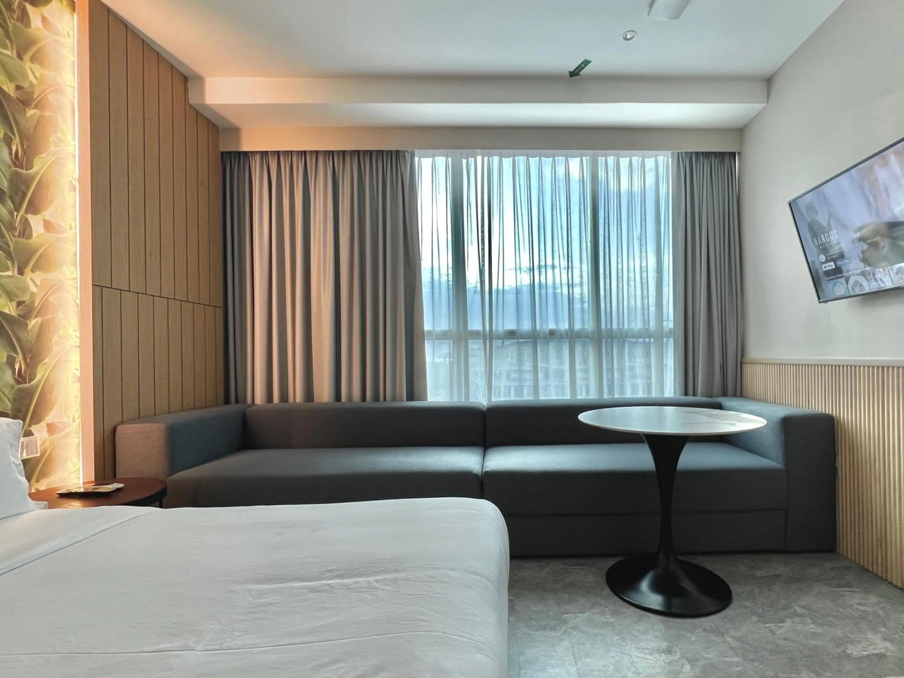 Seating area, Bed in Harper Boutique Hotel at Sutera Avenue