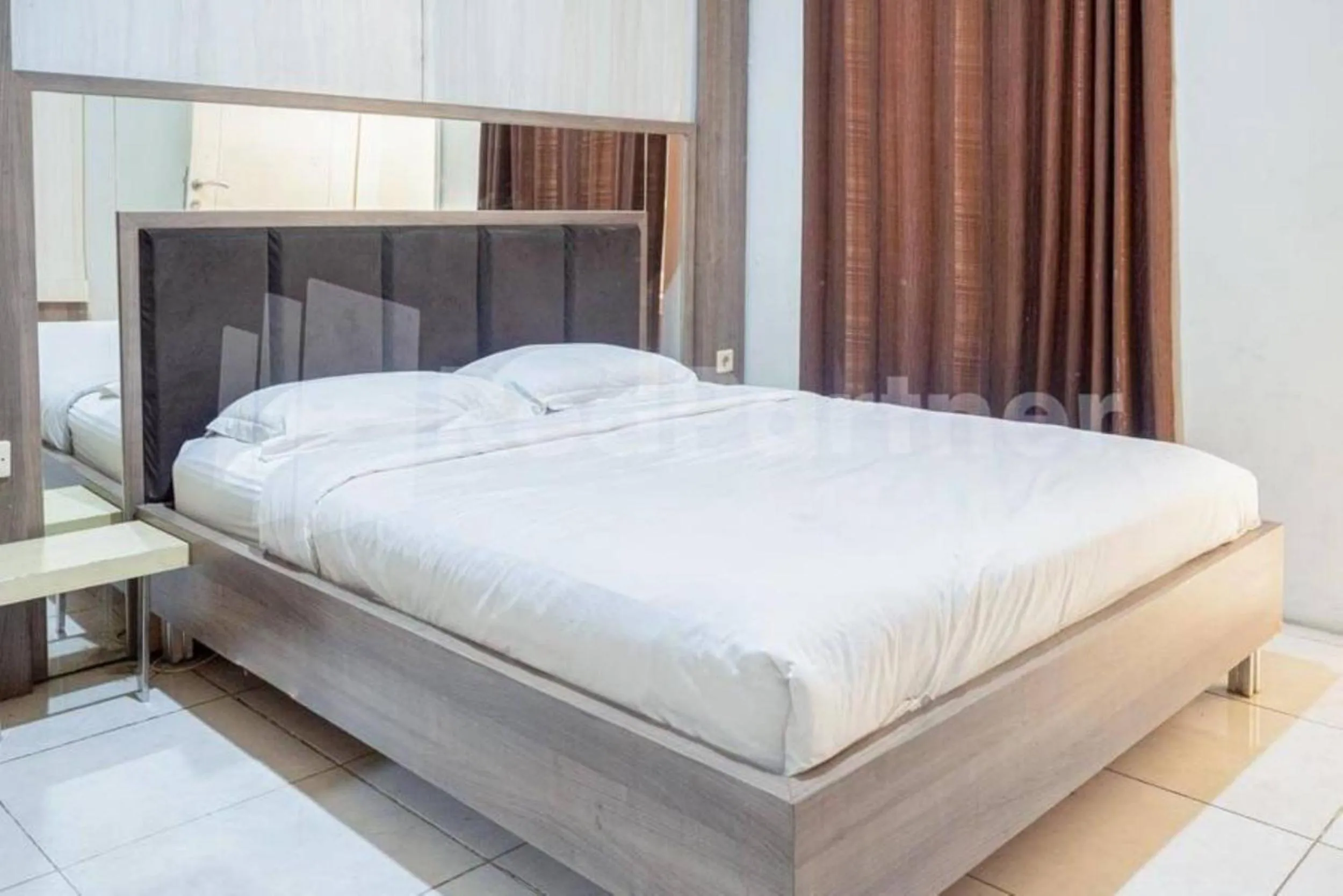 Bed in My Hommy Homestay Mitra RedDoorz