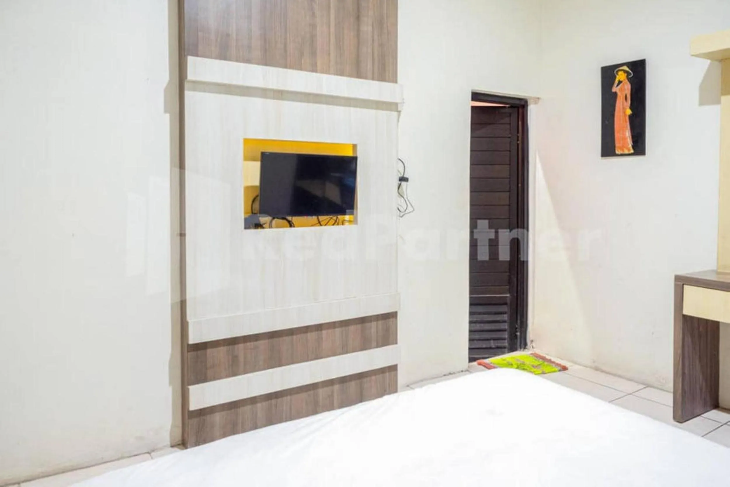 Bed in My Hommy Homestay Mitra RedDoorz