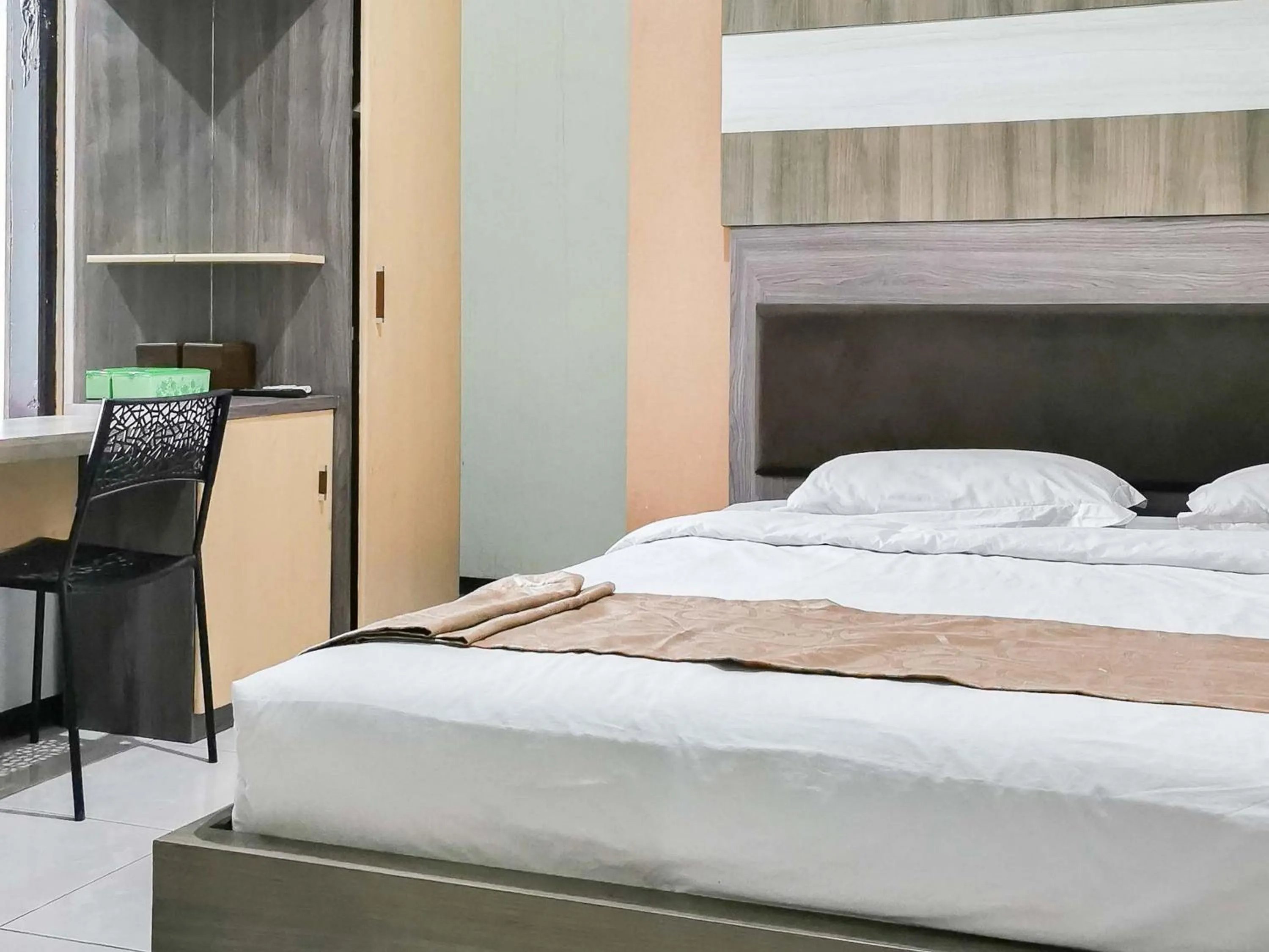 Bed in My Hommy Homestay Mitra RedDoorz