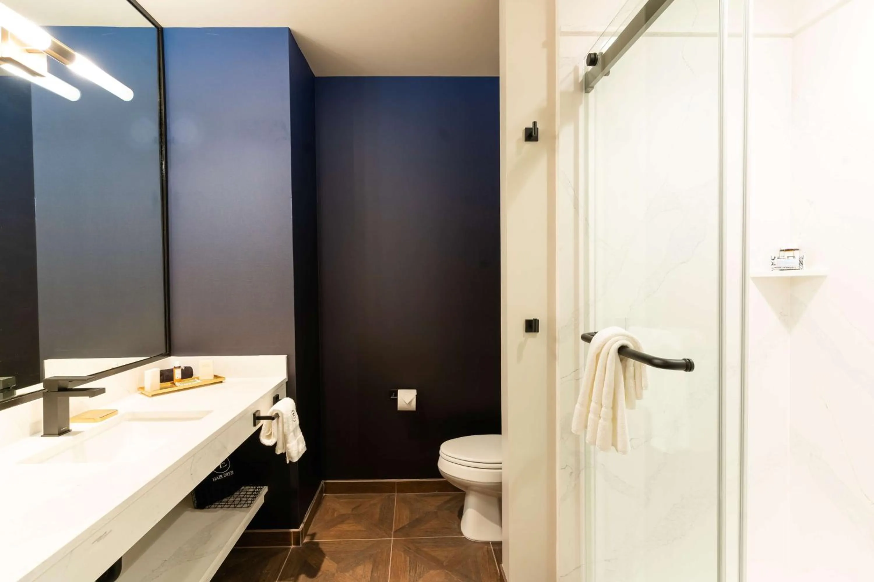 Bathroom in The Exchange Sacramento, Curio Collection By Hilton