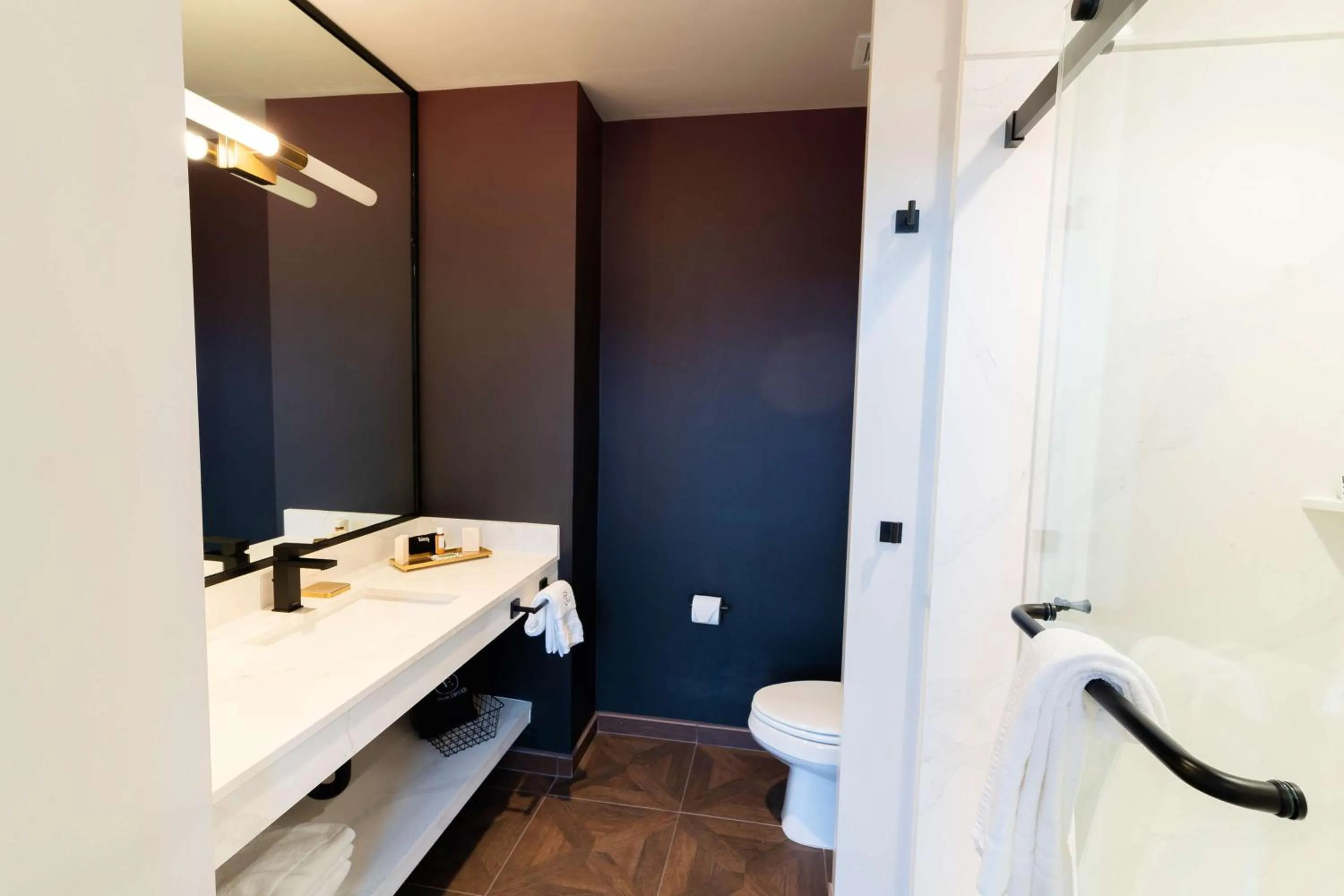 Bathroom in The Exchange Sacramento, Curio Collection By Hilton