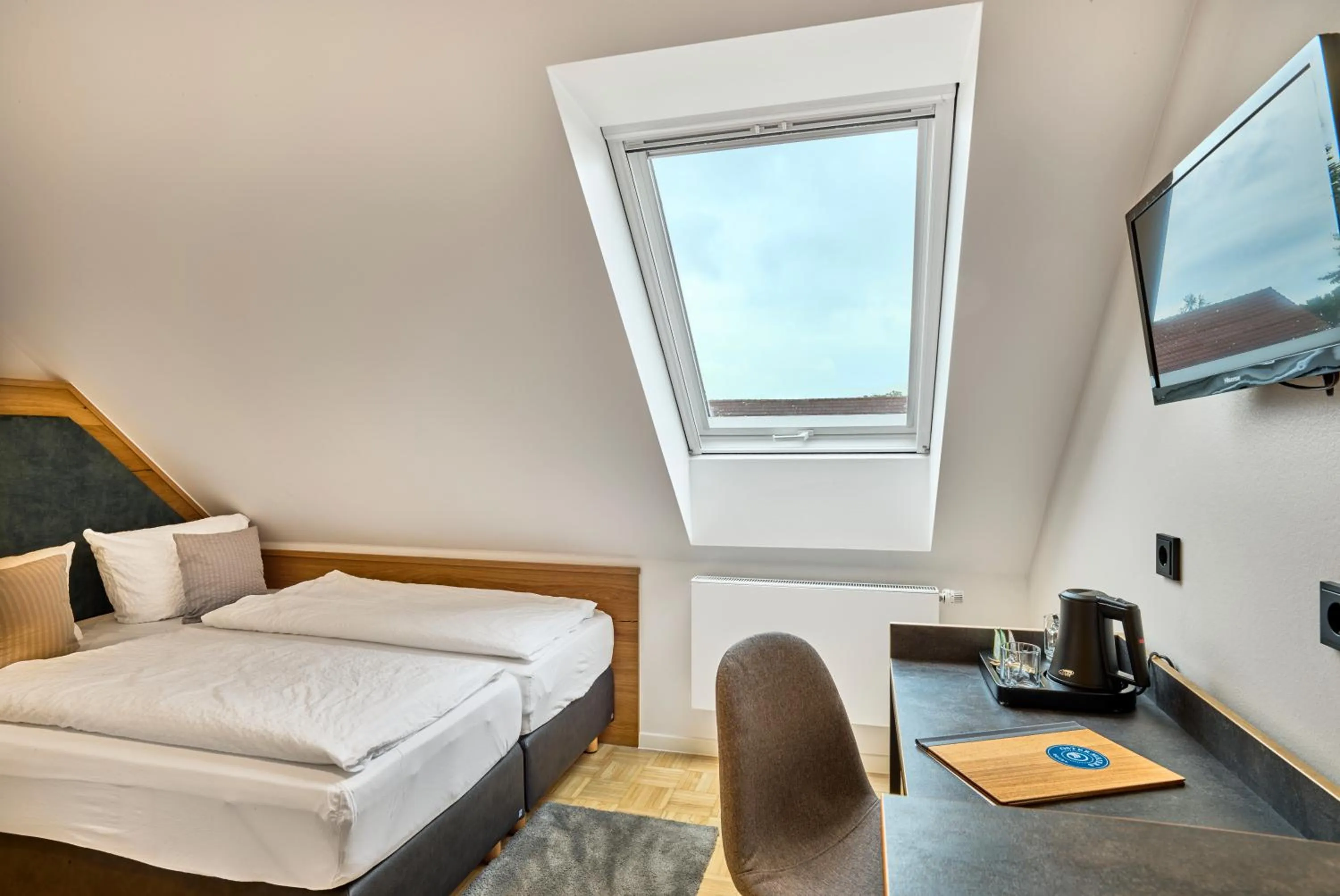 Photo of the whole room, Bed in Gasthaus Hotel Ostermeier