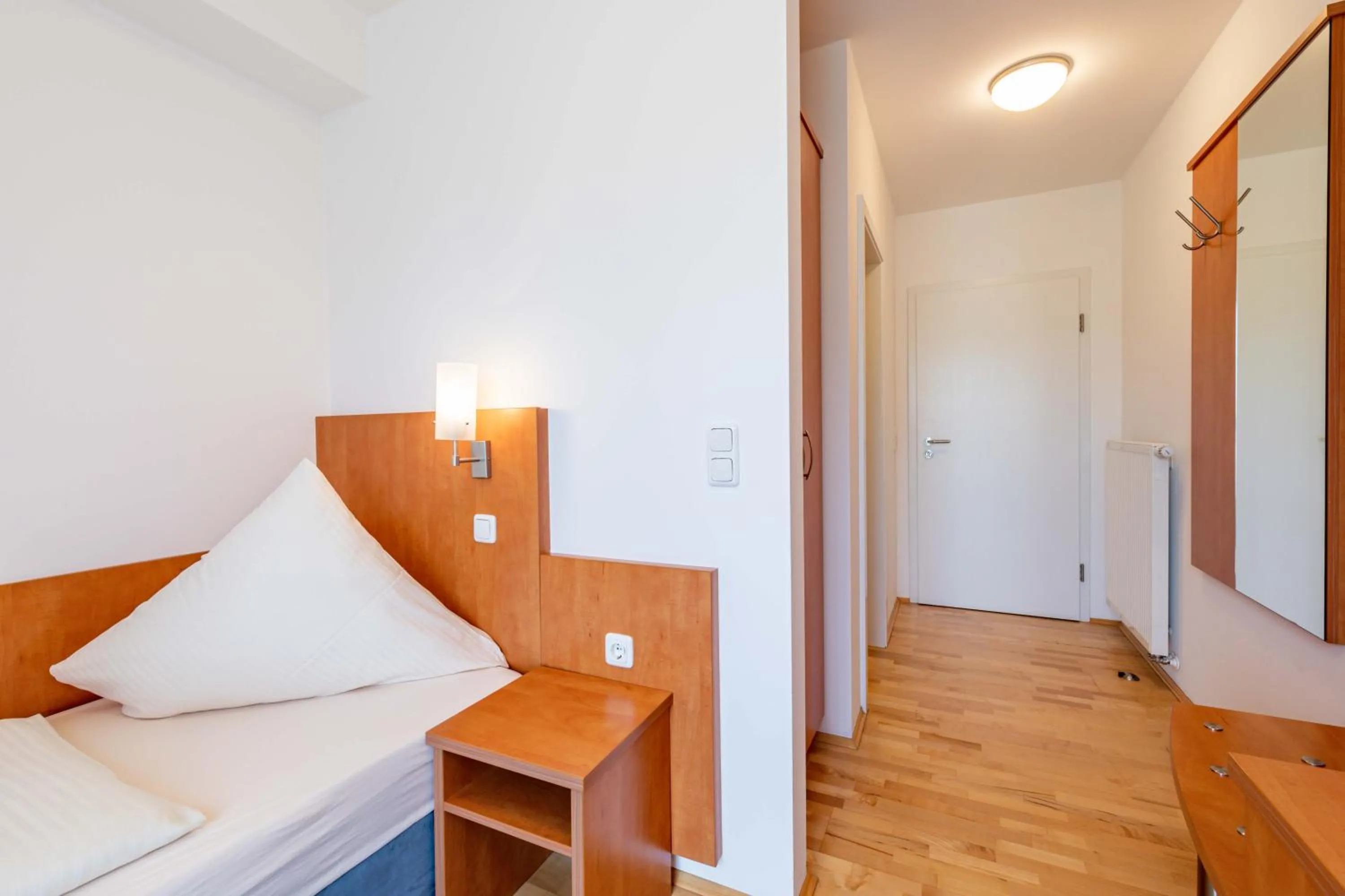 Photo of the whole room, Bed in Gasthaus Hotel Ostermeier