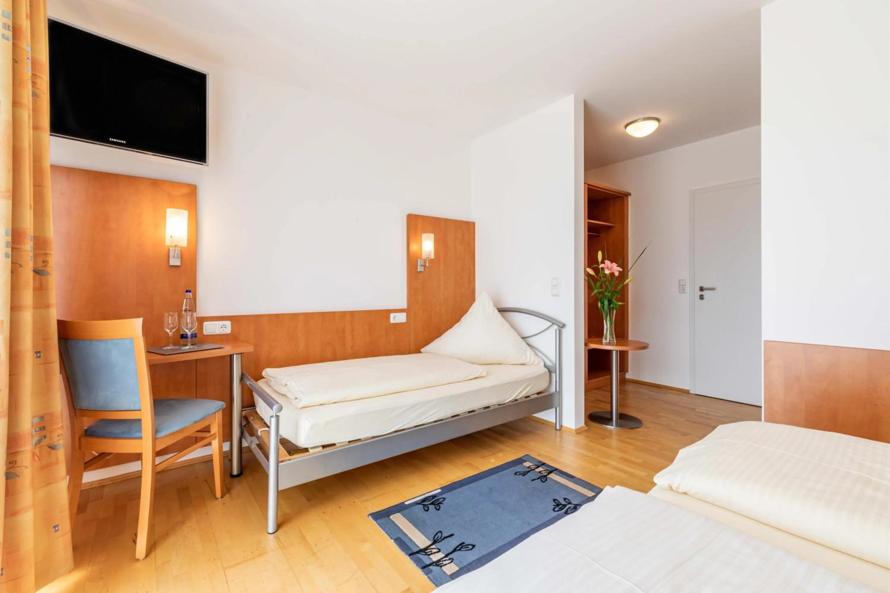 Photo of the whole room, Bed in Gasthaus Hotel Ostermeier