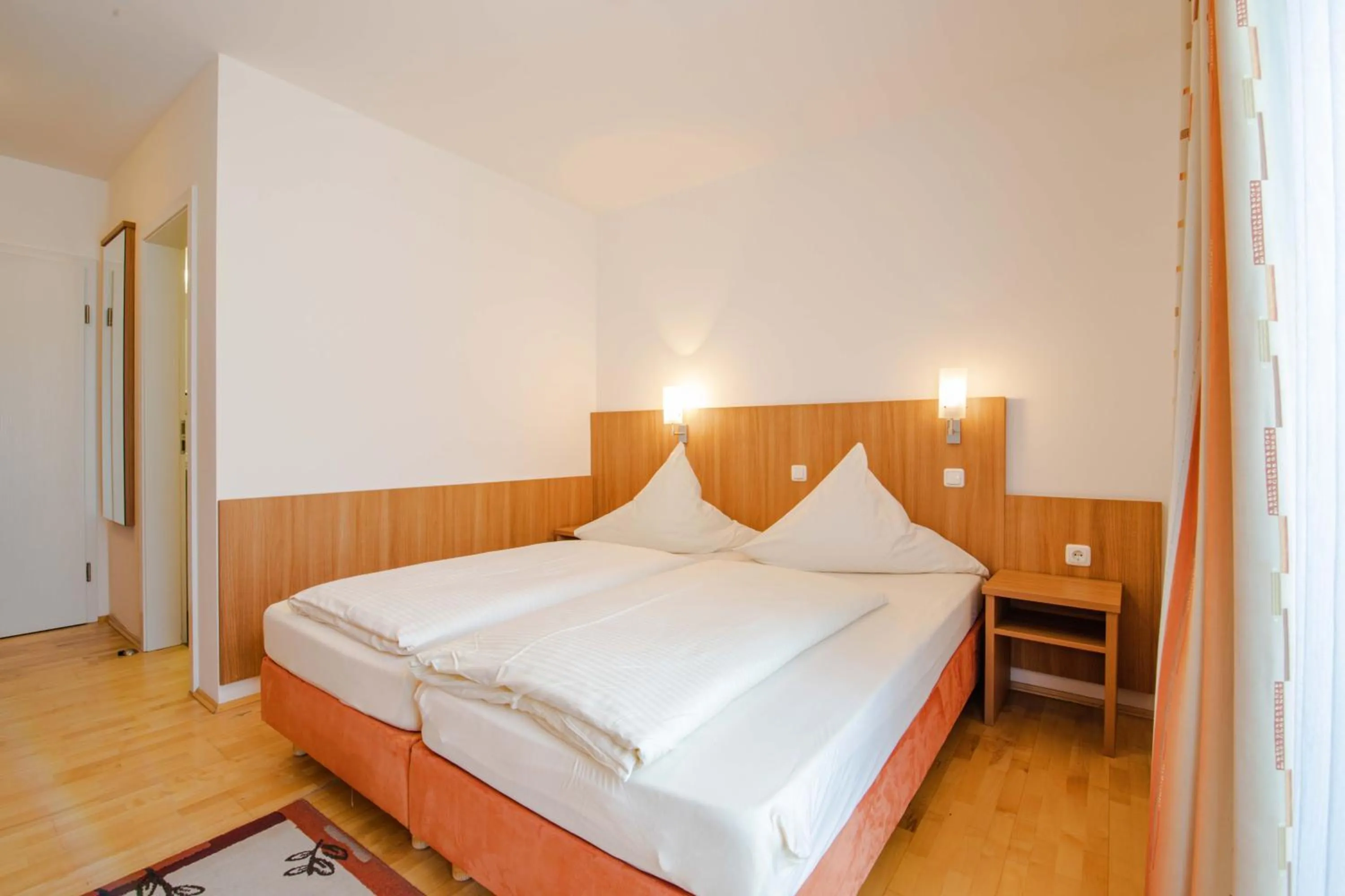 Photo of the whole room, Bed in Gasthaus Hotel Ostermeier
