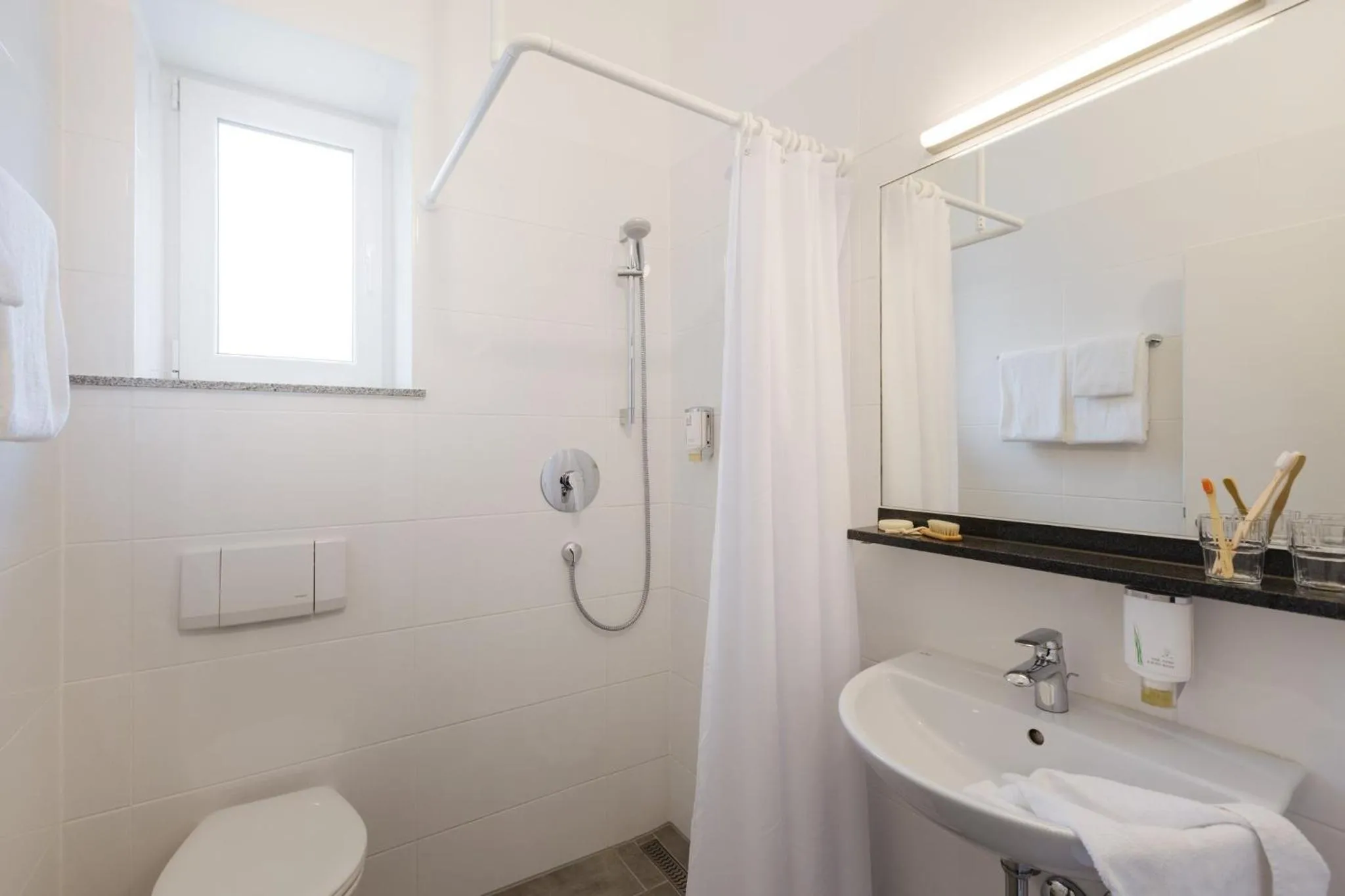 Bathroom in Garner Hotel Stuttgart - Zuffenhausen by IHG