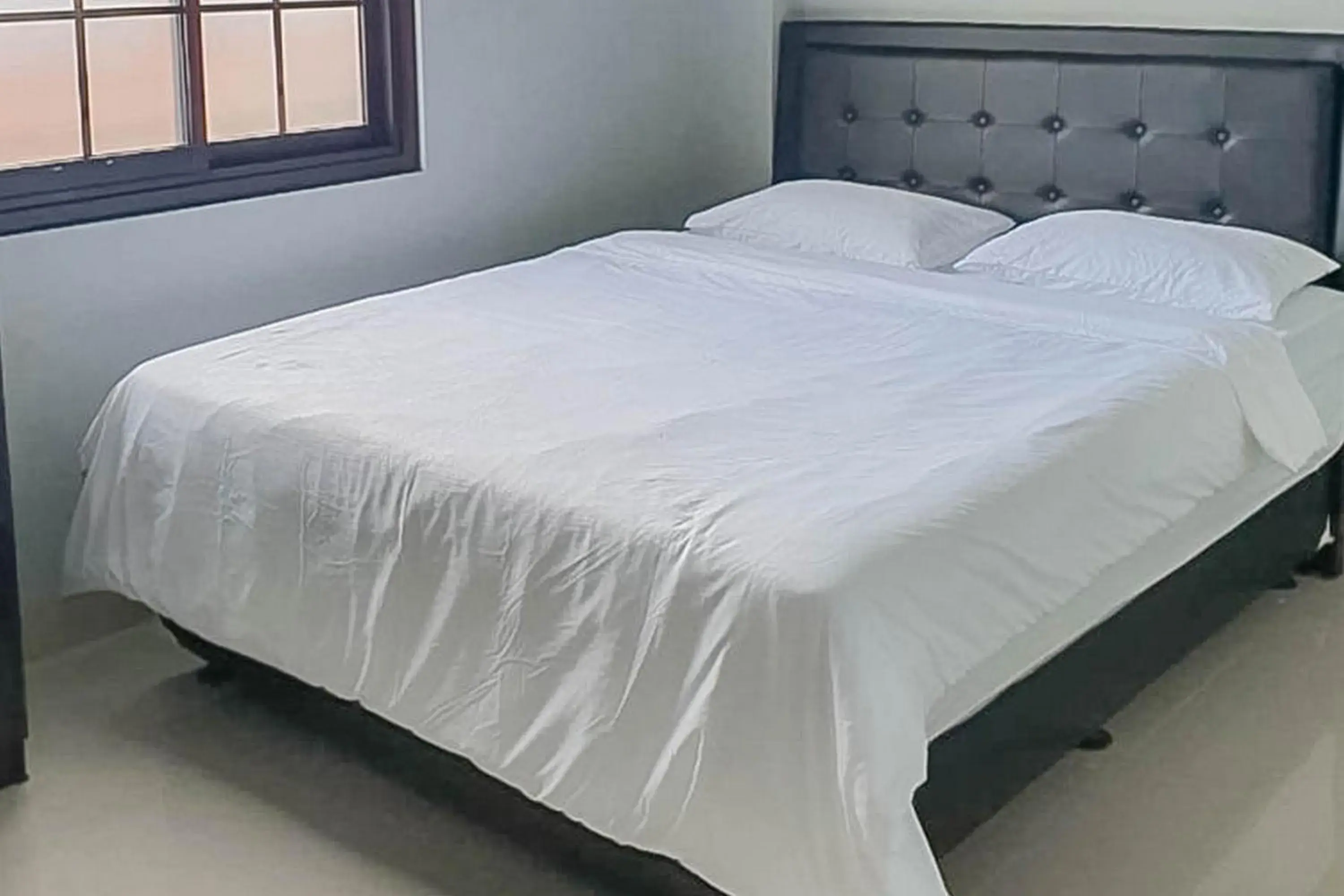 Bed in Mahkota Residence Mitra RedDoorz Bed in Mahkota Residence Mitra RedDoorz