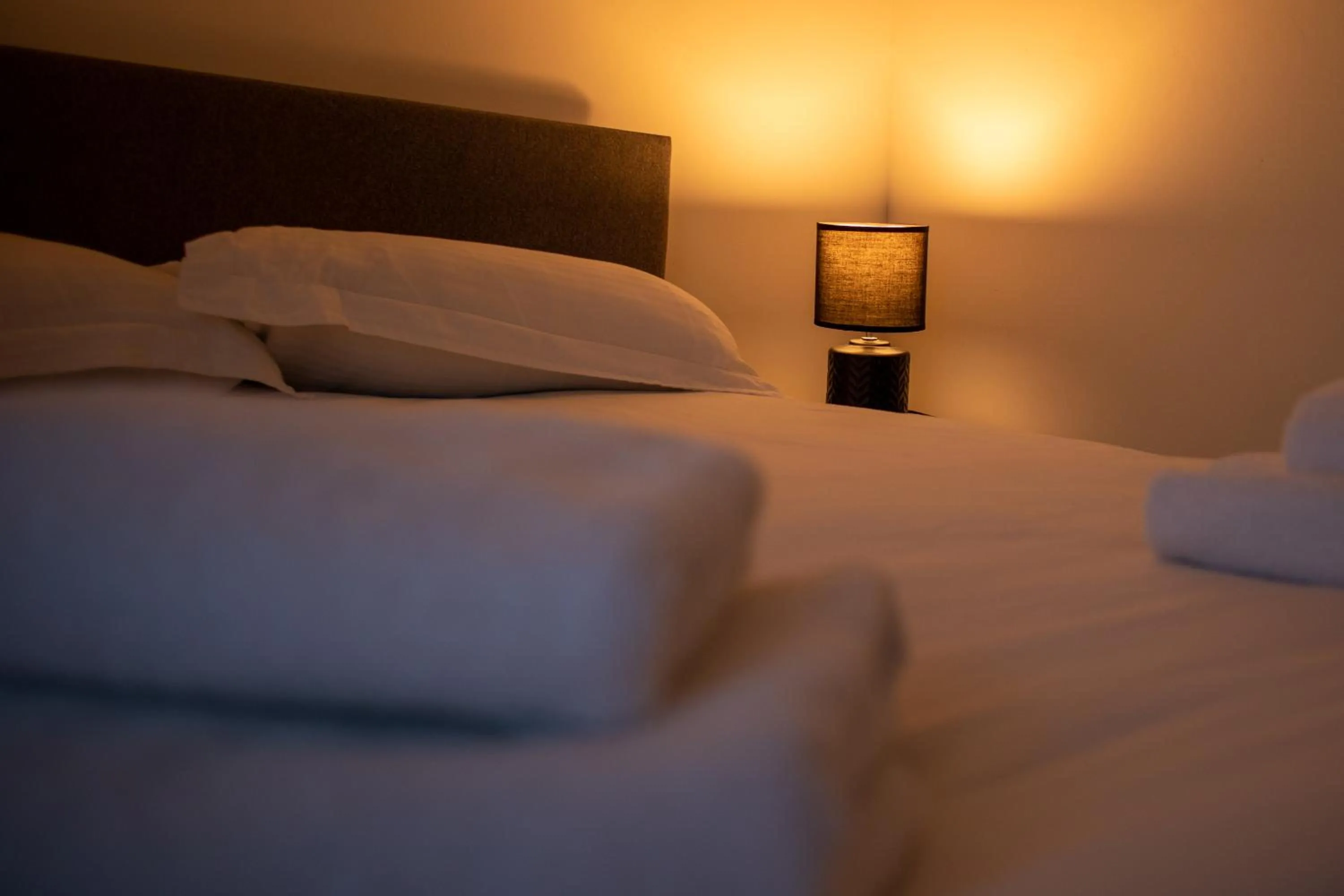 Bedroom, Bed in Silver City Apartments, Historic Apartment