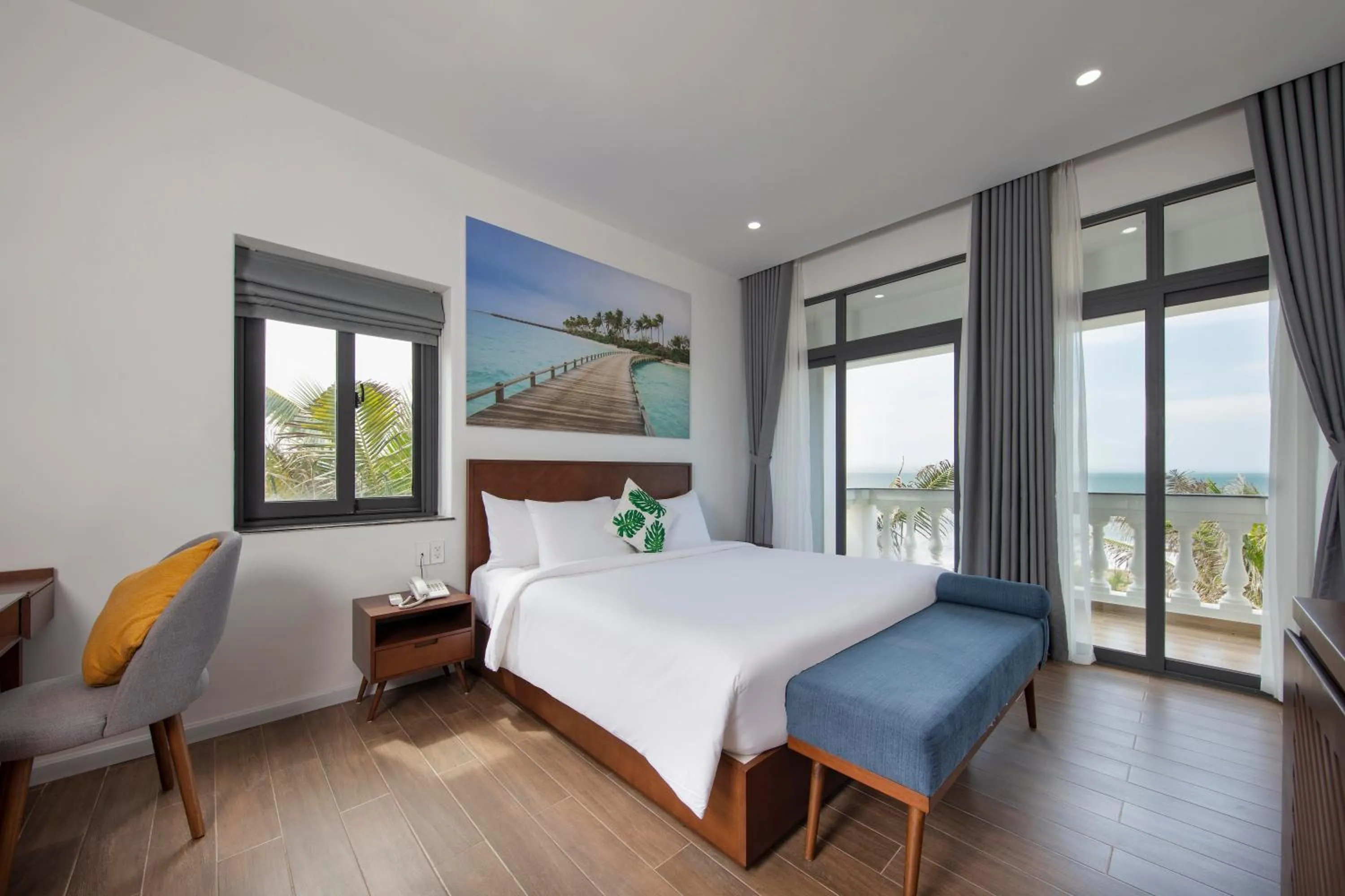 Bedroom, Bed in Le Palmier Ho Tram Resort - Beachfront with Private Beach