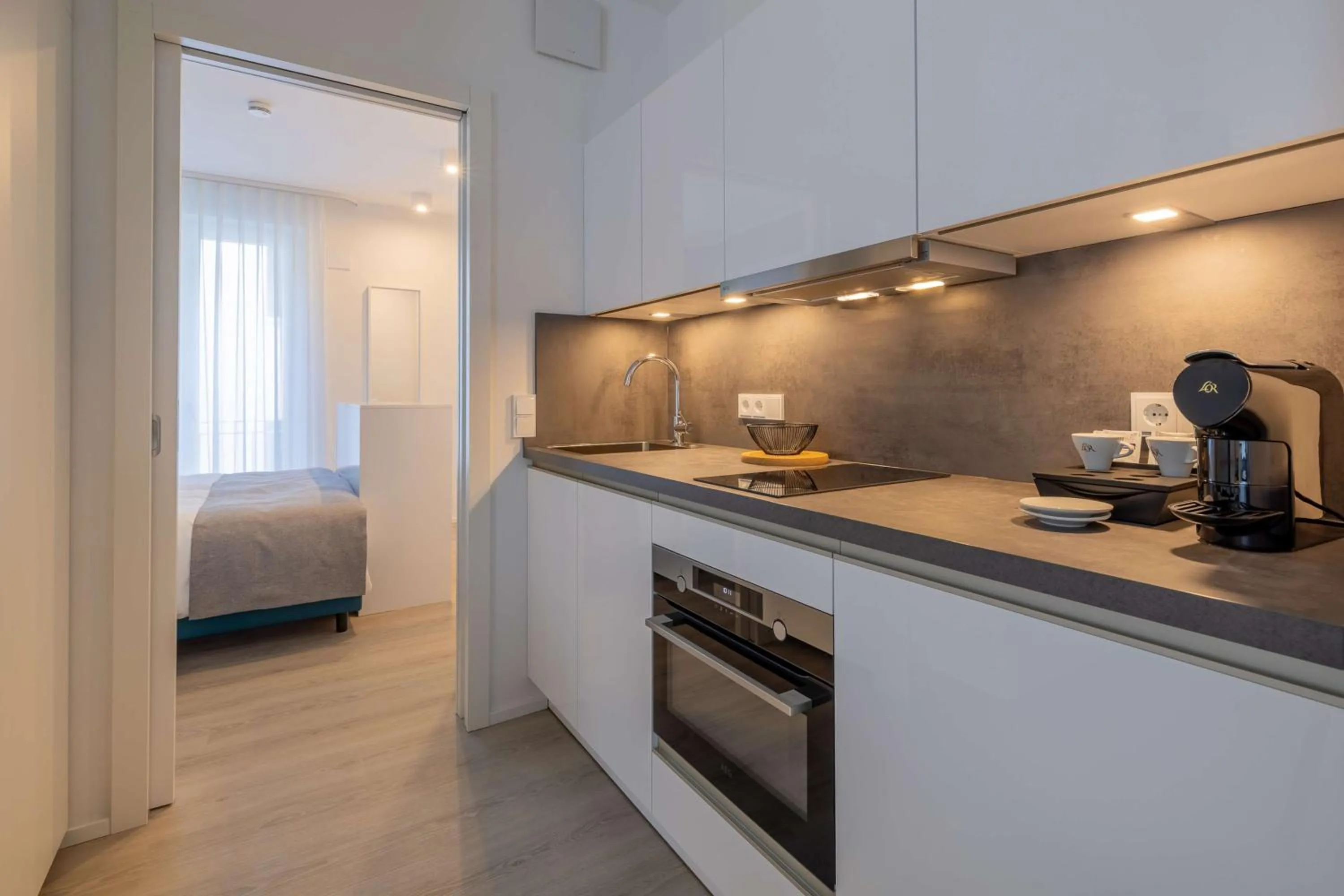 Kitchen or kitchenette, Bed in ATLANTIC Grand Hotel Travemünde