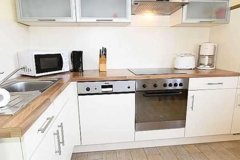 Kitchen or kitchenette in Haus am Deich Feriendomizil mit Terrasse