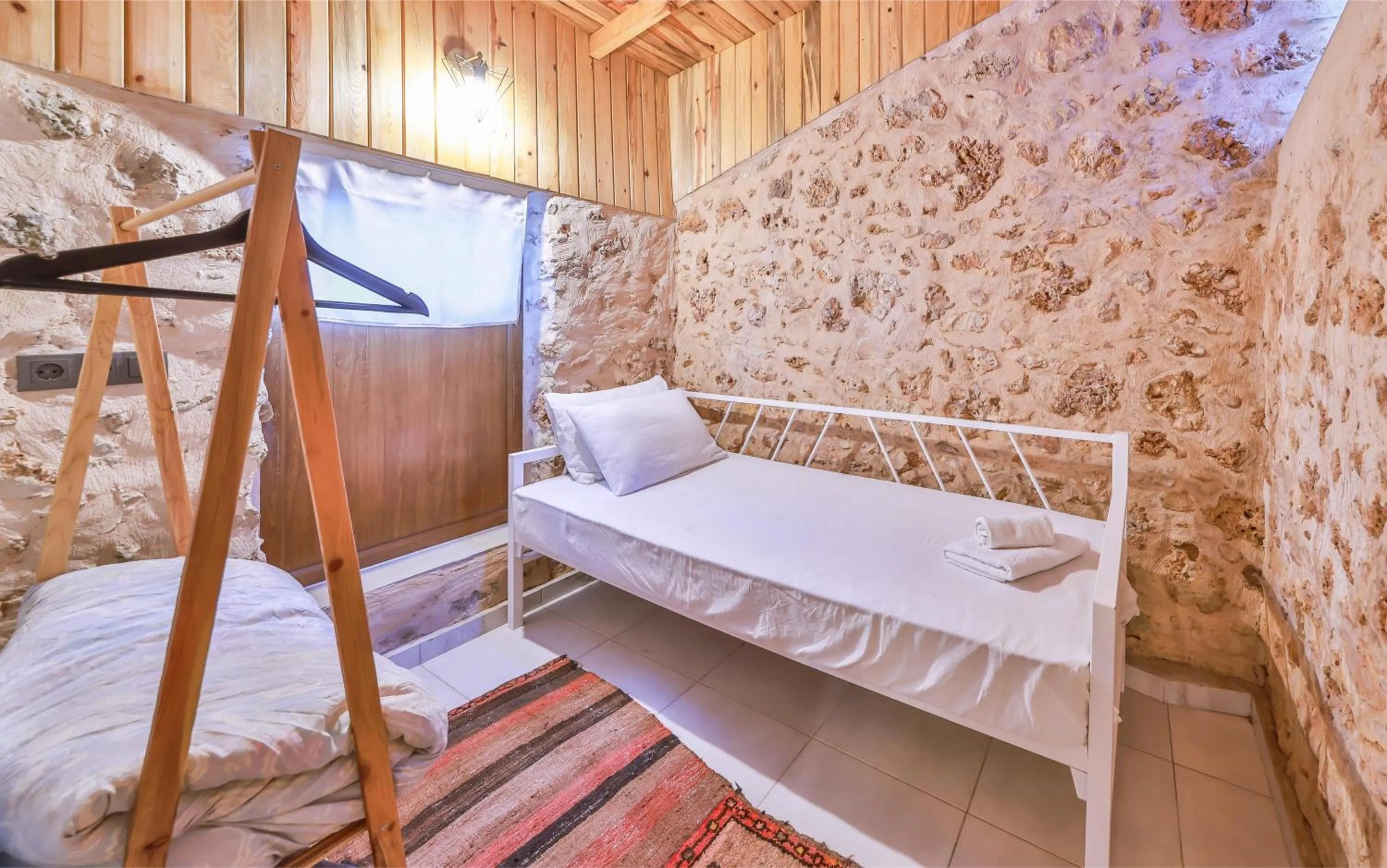 Bed in Bademlique Stone Rooms