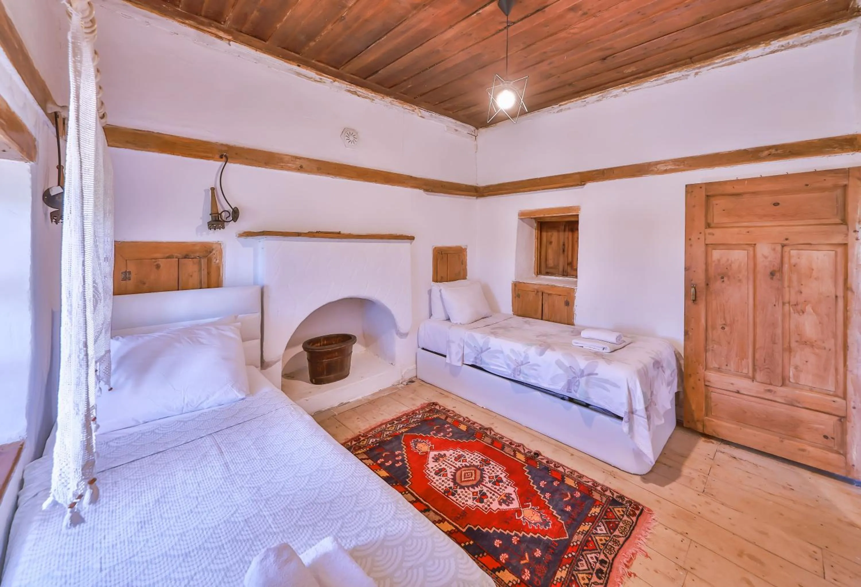 Bed in Bademlique Stone Rooms