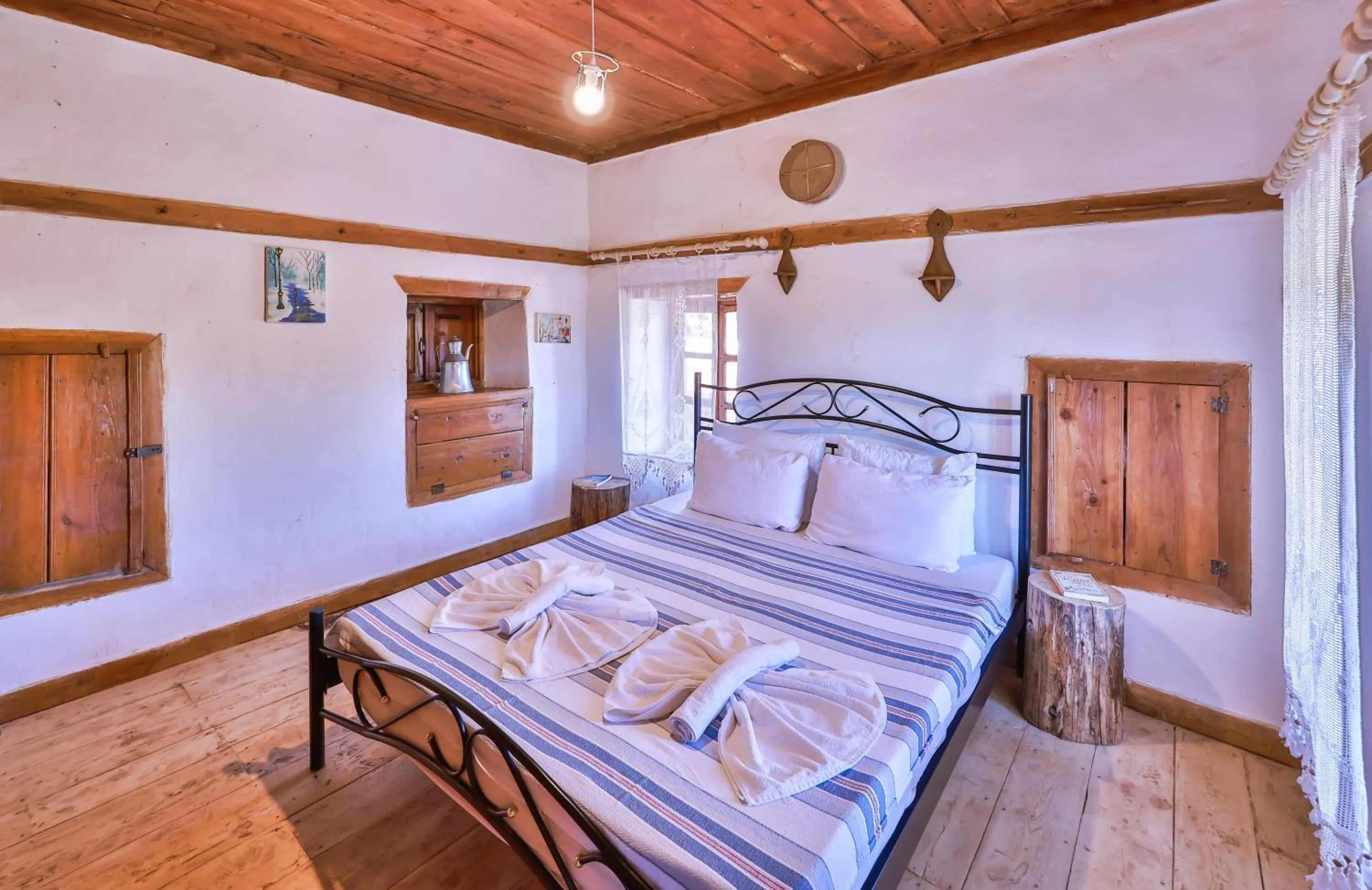 Bed in Bademlique Stone Rooms