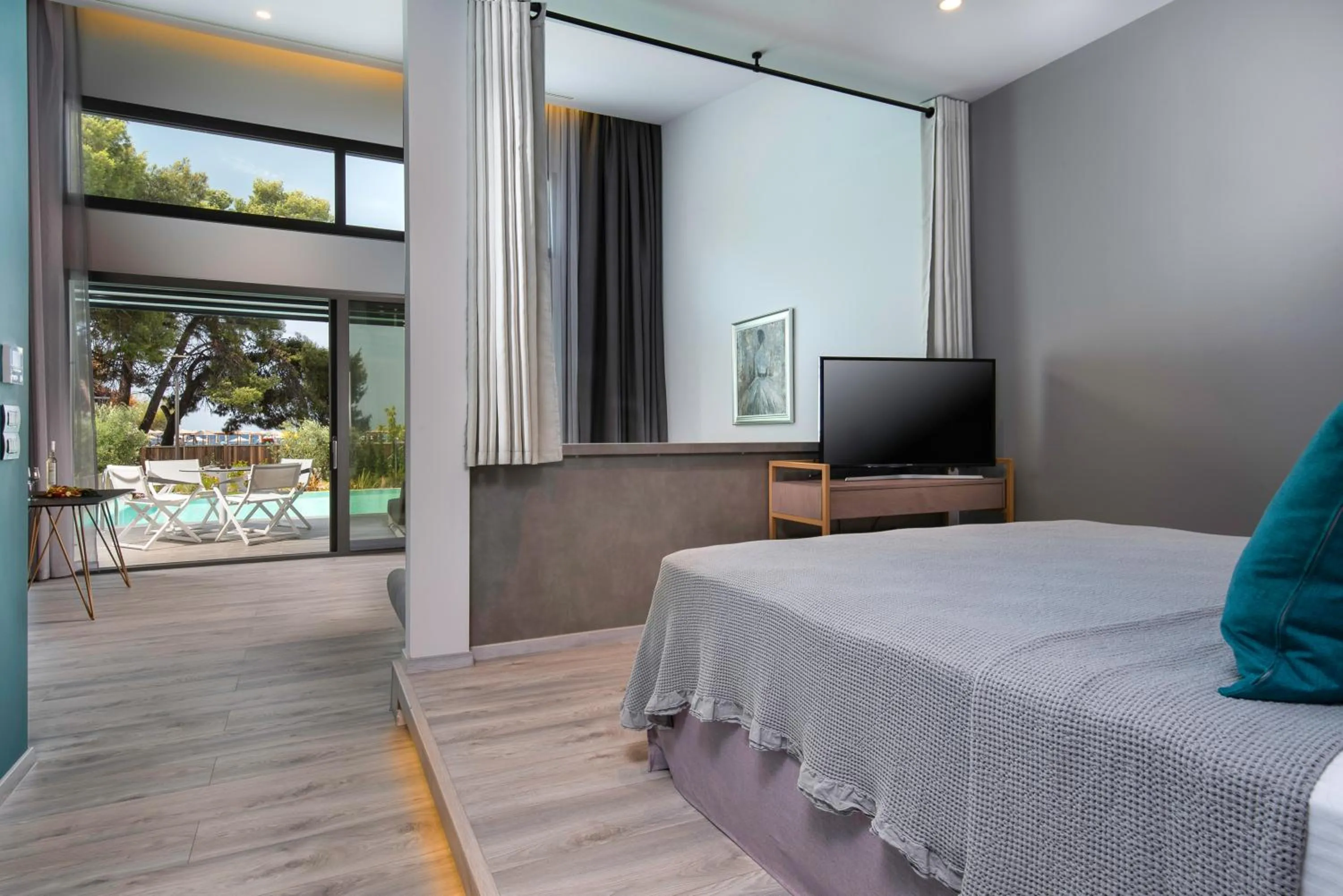 Bed in Lagomandra Luxury Suites with Private Pools