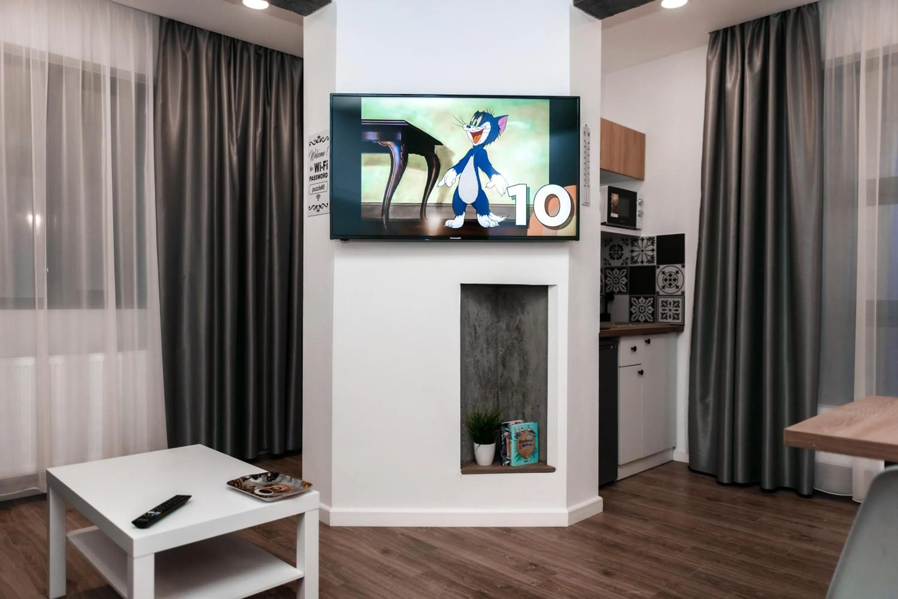 TV and multimedia in Puzzle Apartaments&Studios