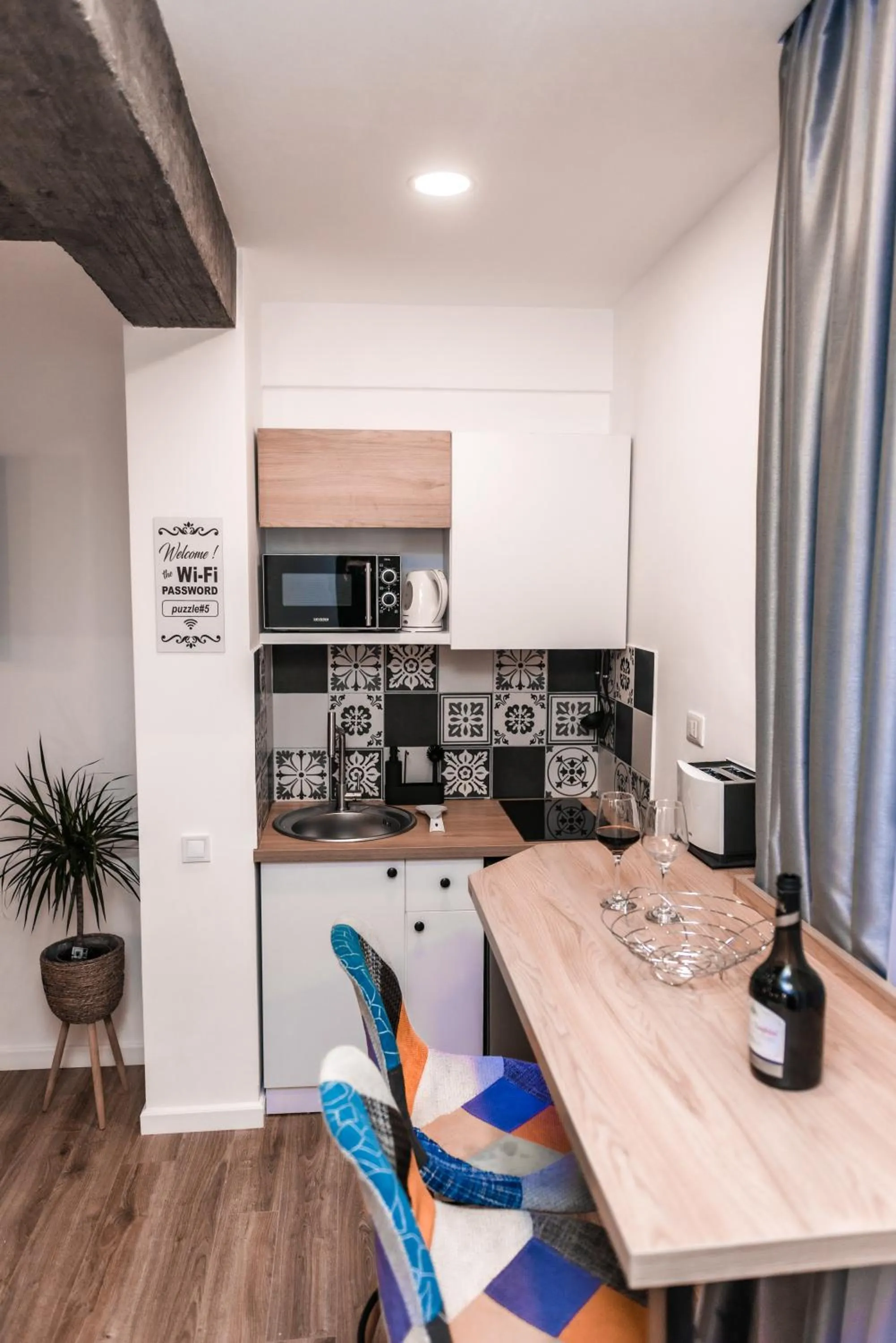 Kitchen or kitchenette in Puzzle Apartaments&Studios