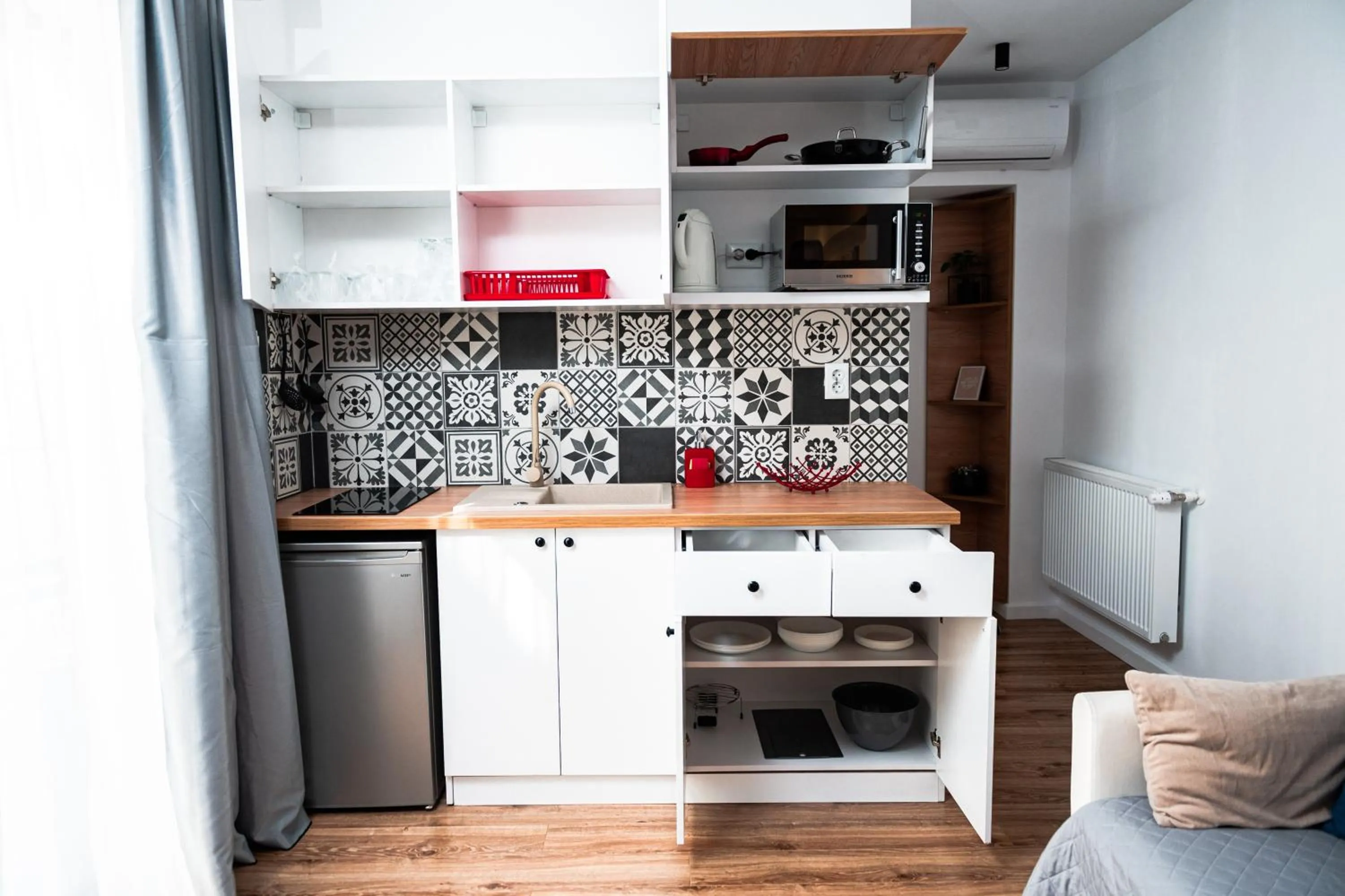 Kitchen or kitchenette in Puzzle Apartaments&Studios