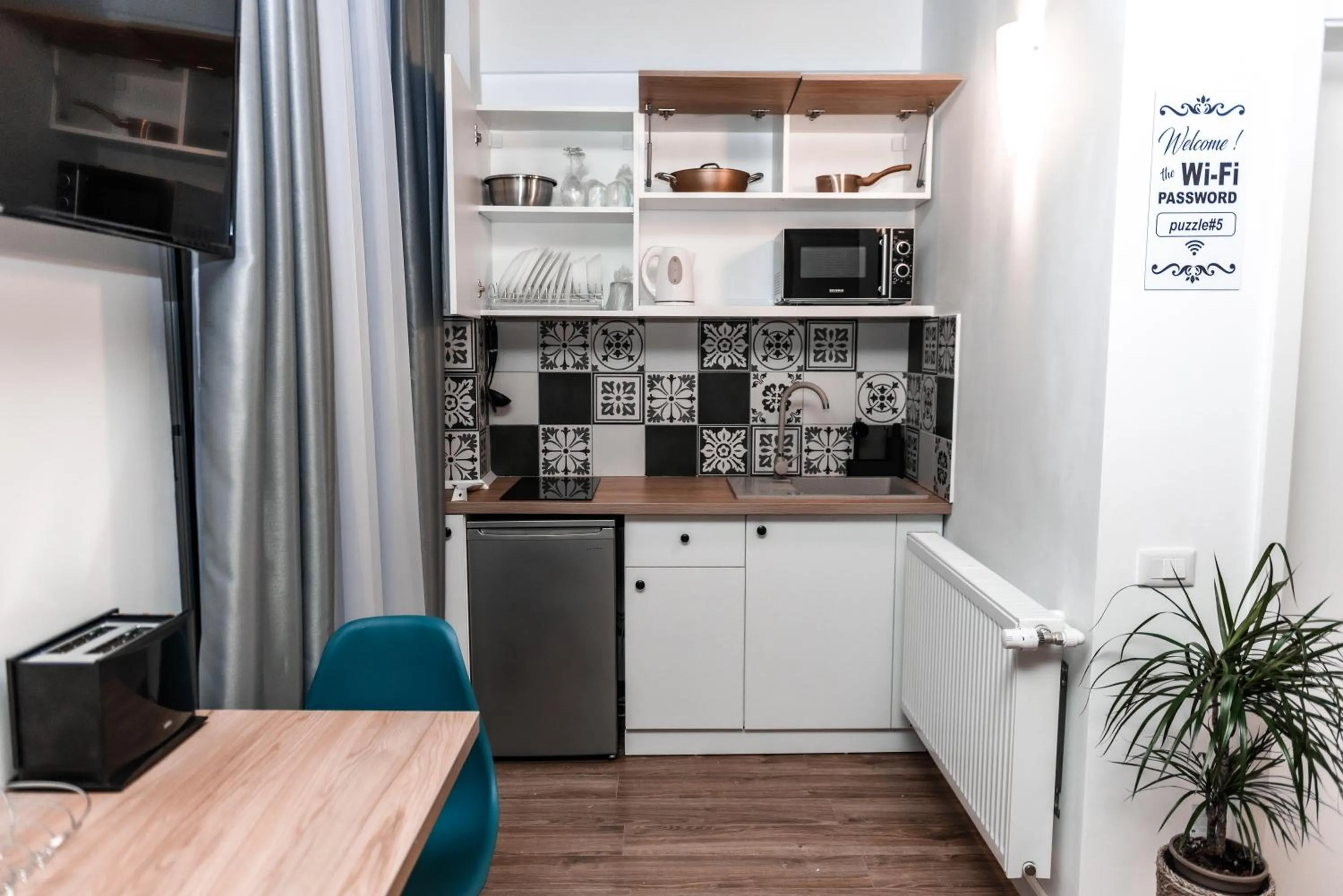 Kitchen or kitchenette in Puzzle Apartaments&Studios