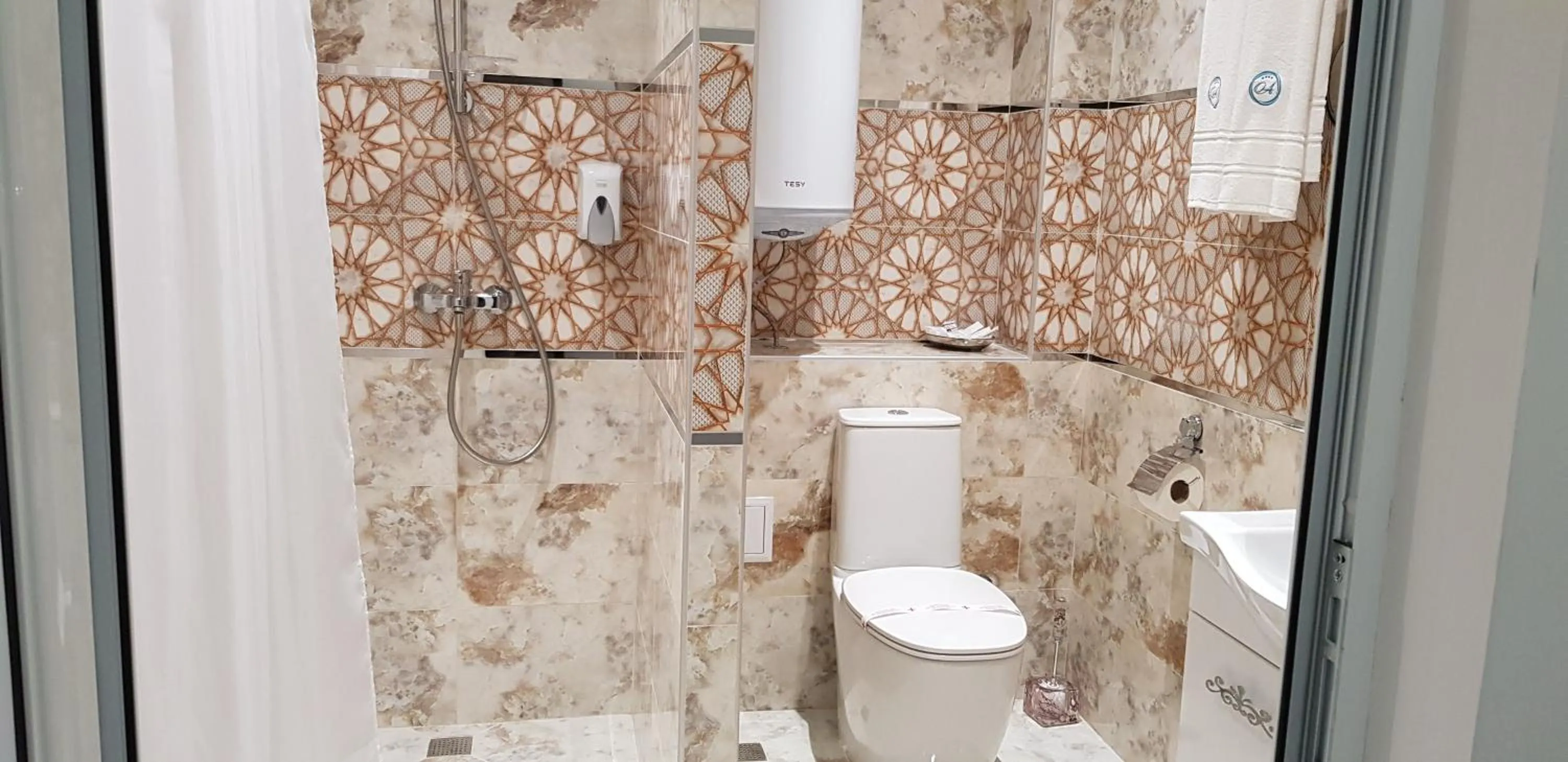 Bathroom in Aparthotel Olympus Plaza - SPA & Indoor Pool