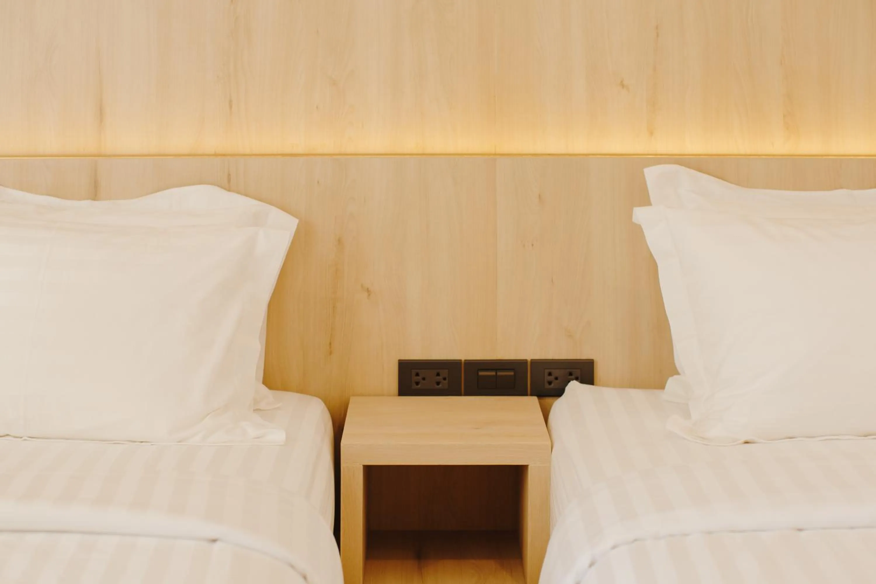 Bed in Poodson Hotel Chiangmai