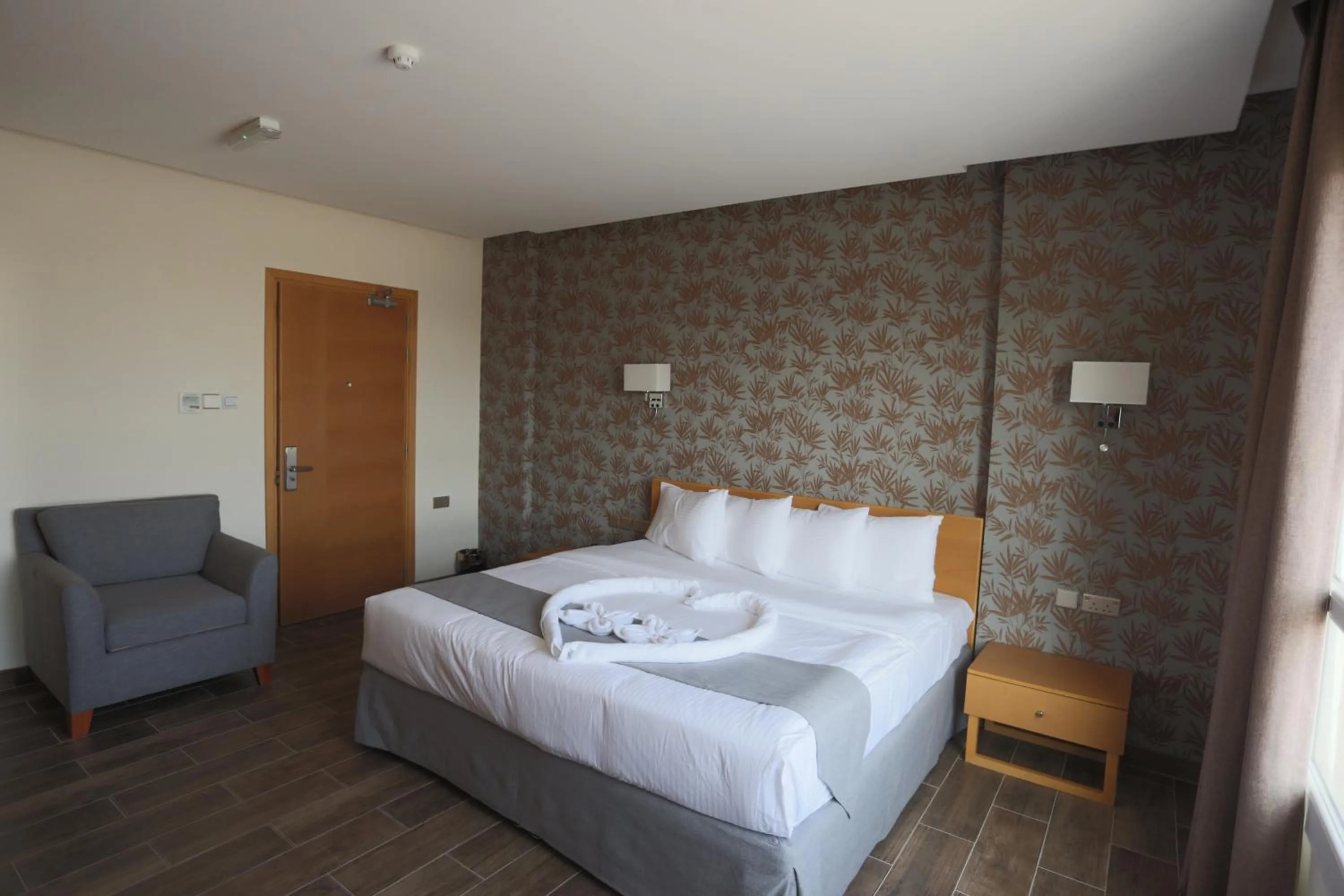 Photo of the whole room, Bed in Sama Muscat Hotel