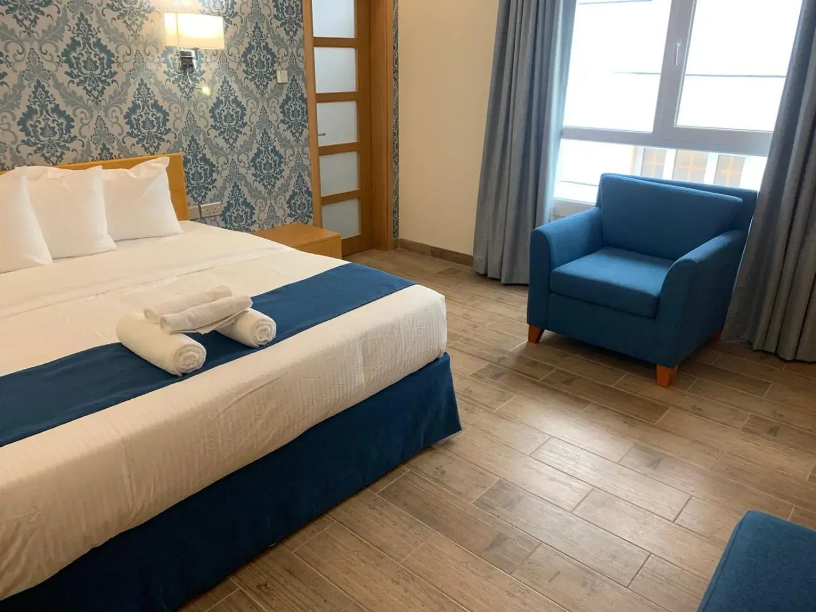 Seating area, Bed in Sama Muscat Hotel Seating area, Bed in Sama Muscat Hotel