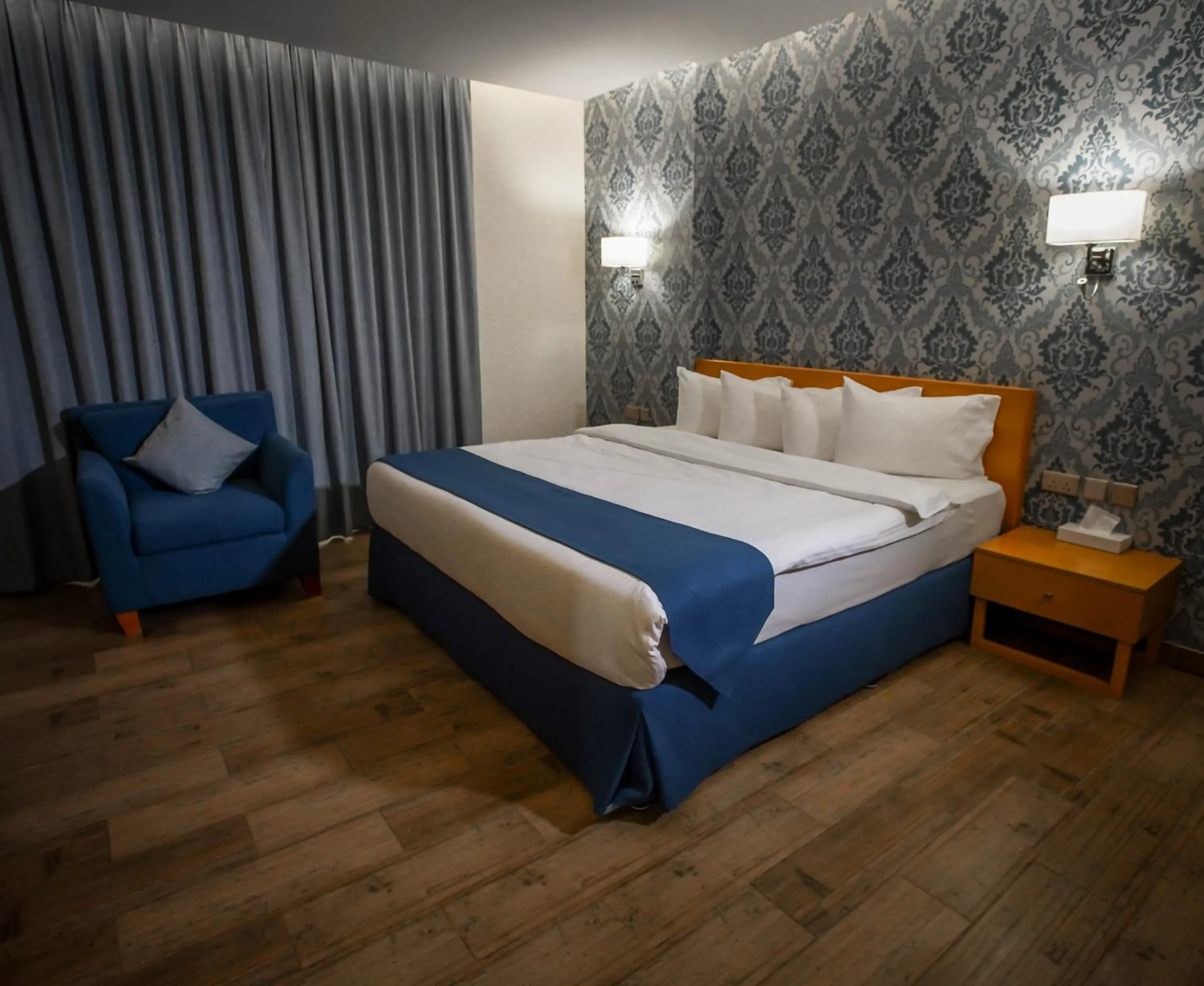 Bed in Sama Muscat Hotel