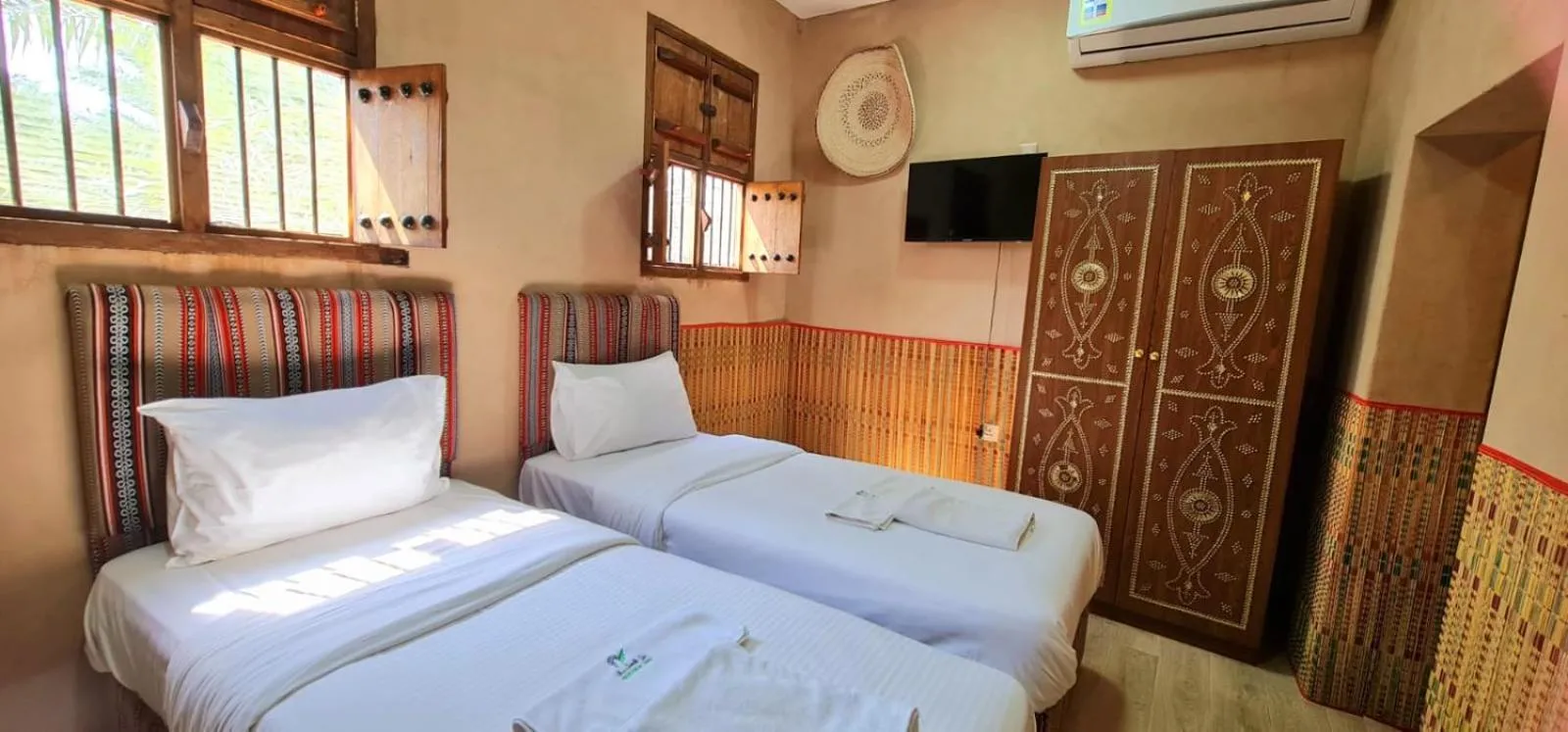 Bed in Bustan inn by Alley Escape
